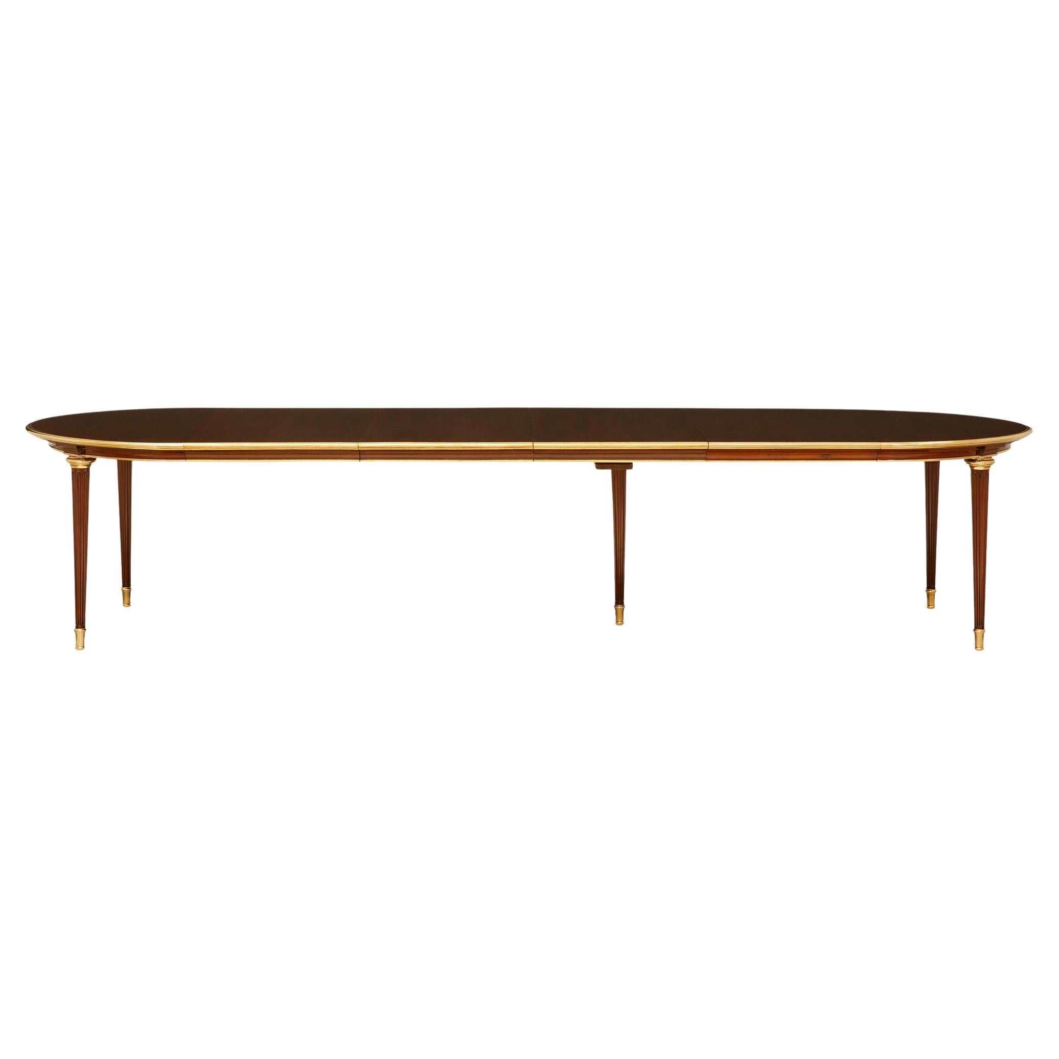 French Turn of the Century Louis XVI st. Mahogany and Ormolu dining table For Sale