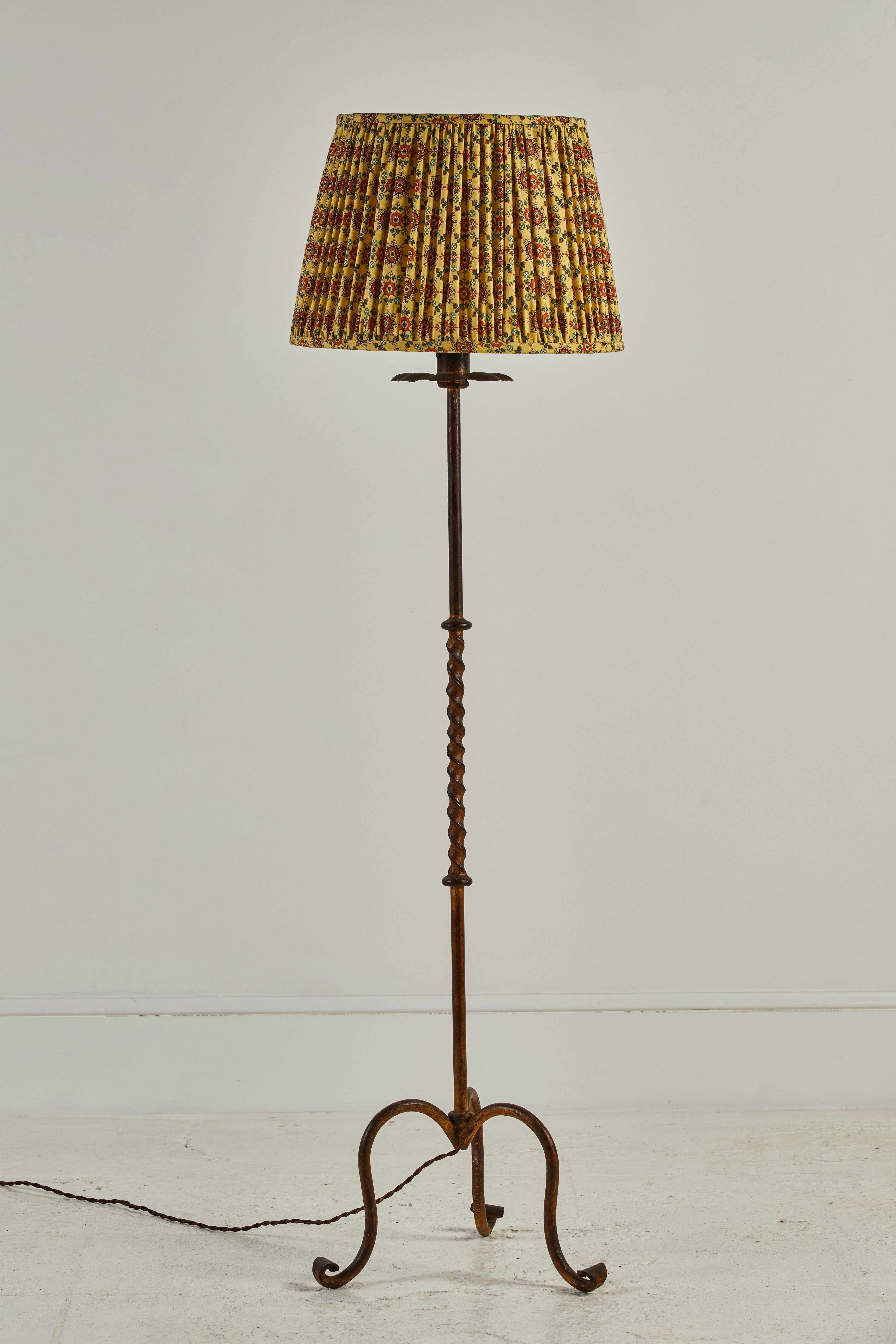 French turned brass floor lamp with a top floral detail. Custom yellow orange and green shirred fabric shade.