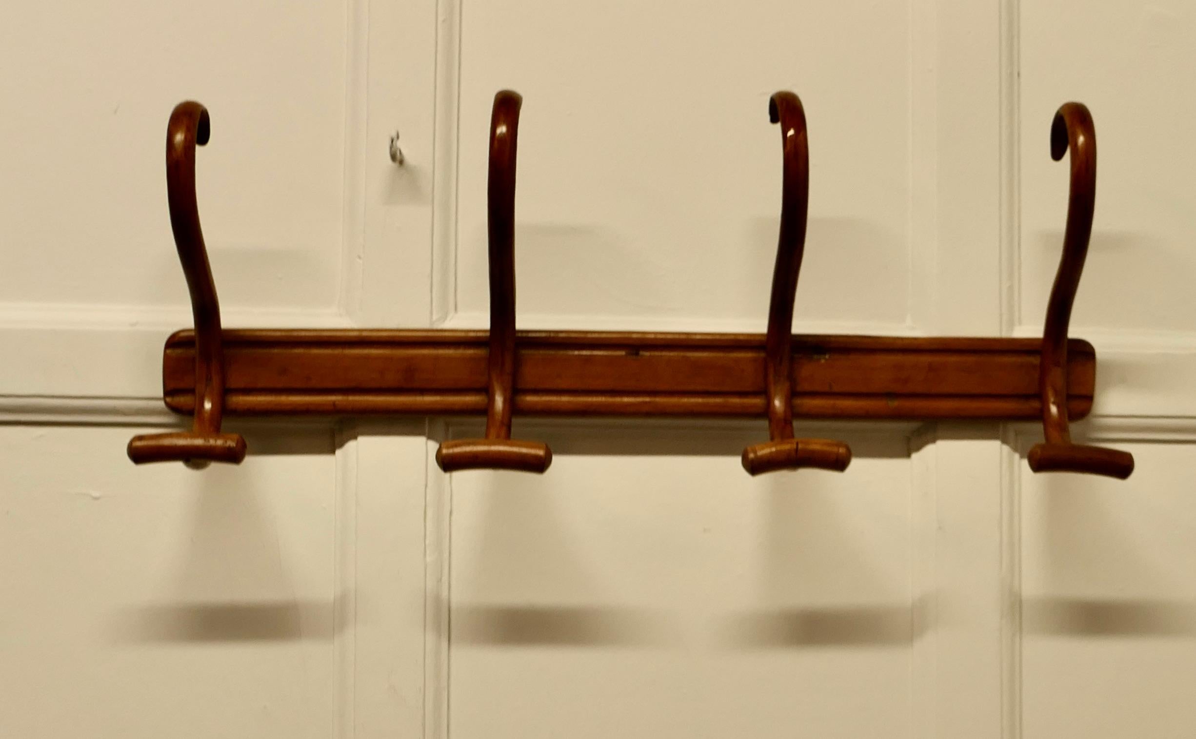 French Turned Golden Beech Hat and Coat Rack

This is a very attractive piece it is a wall hanging piece, it has 4 large swan neck bent wood double hooks it would make a good hall piece where space is limited
This is a good looking piece with a