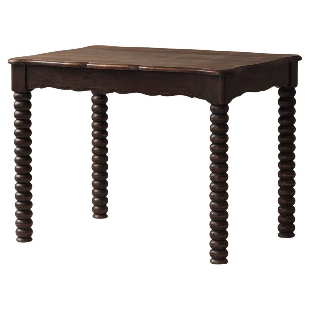 French turned oak table in the taste of Charles Dudouyt, France 1940s For Sale