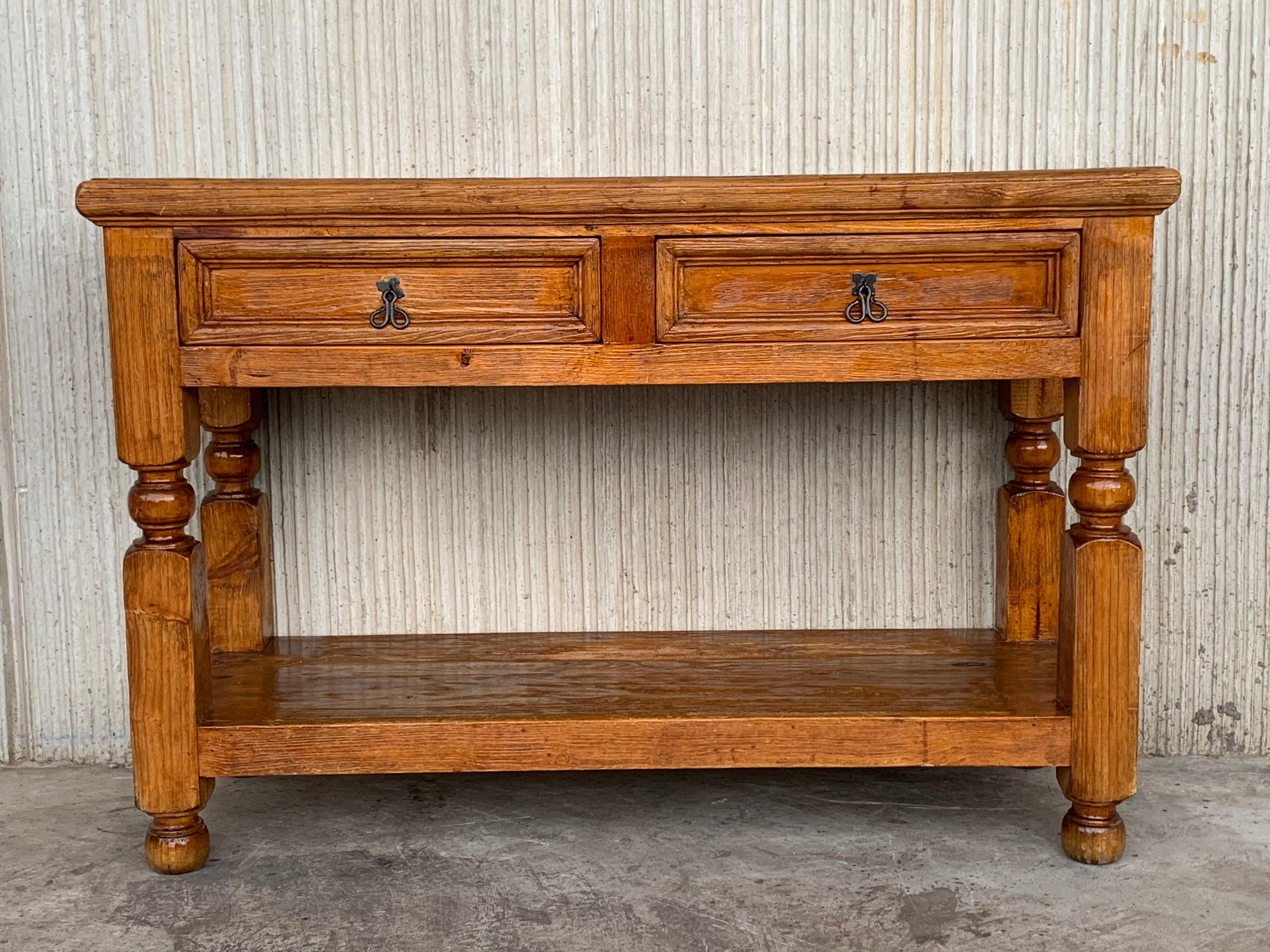 Two-drawer French pine console - side table. Practical French side table with two drawers and lower shelve. Good color throughout with good detail and original iron handles.

Measure: Low shelve 7.28in.