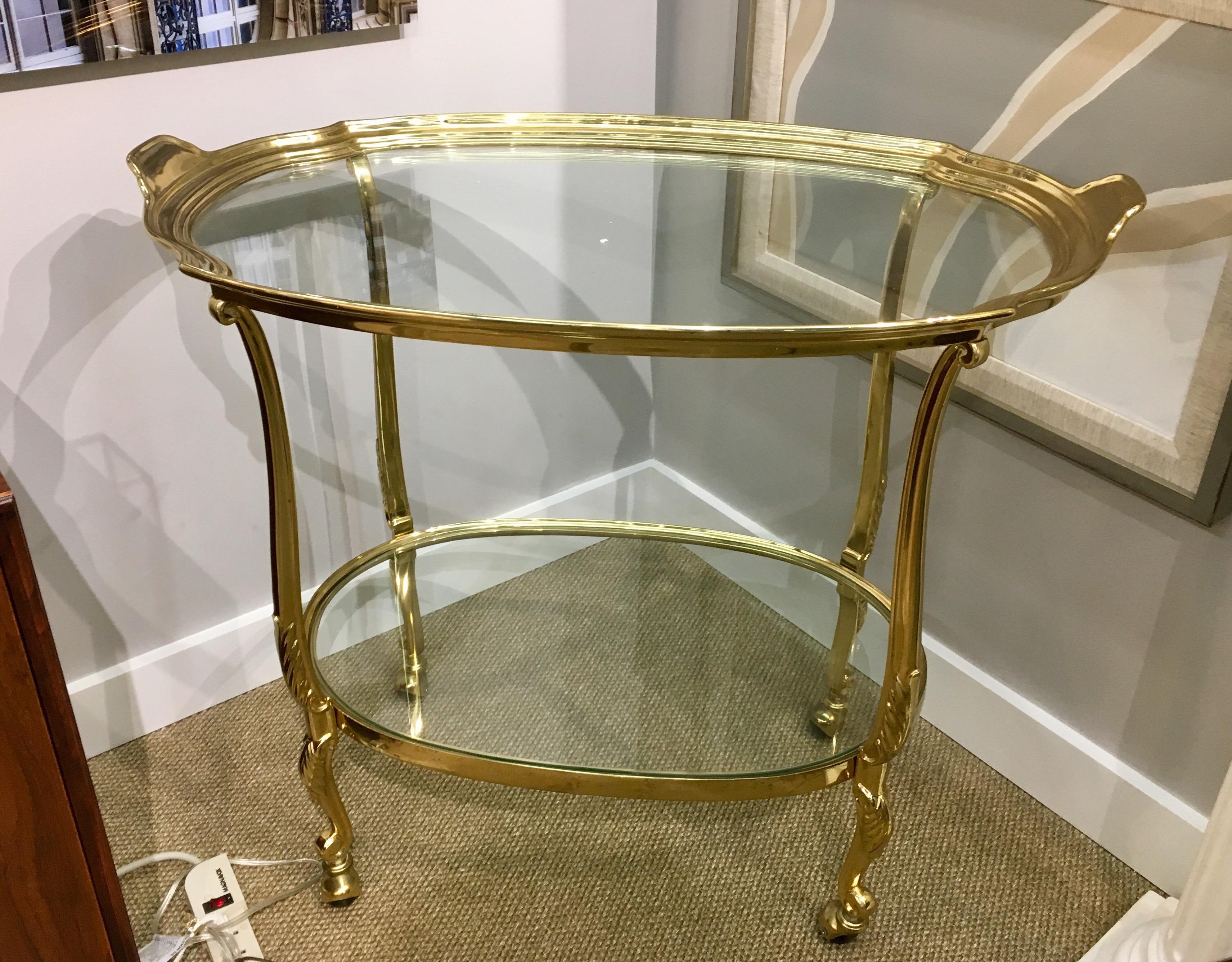 Heavy, all brass bar cart with two tiers of glass. Made in France, 1960s.