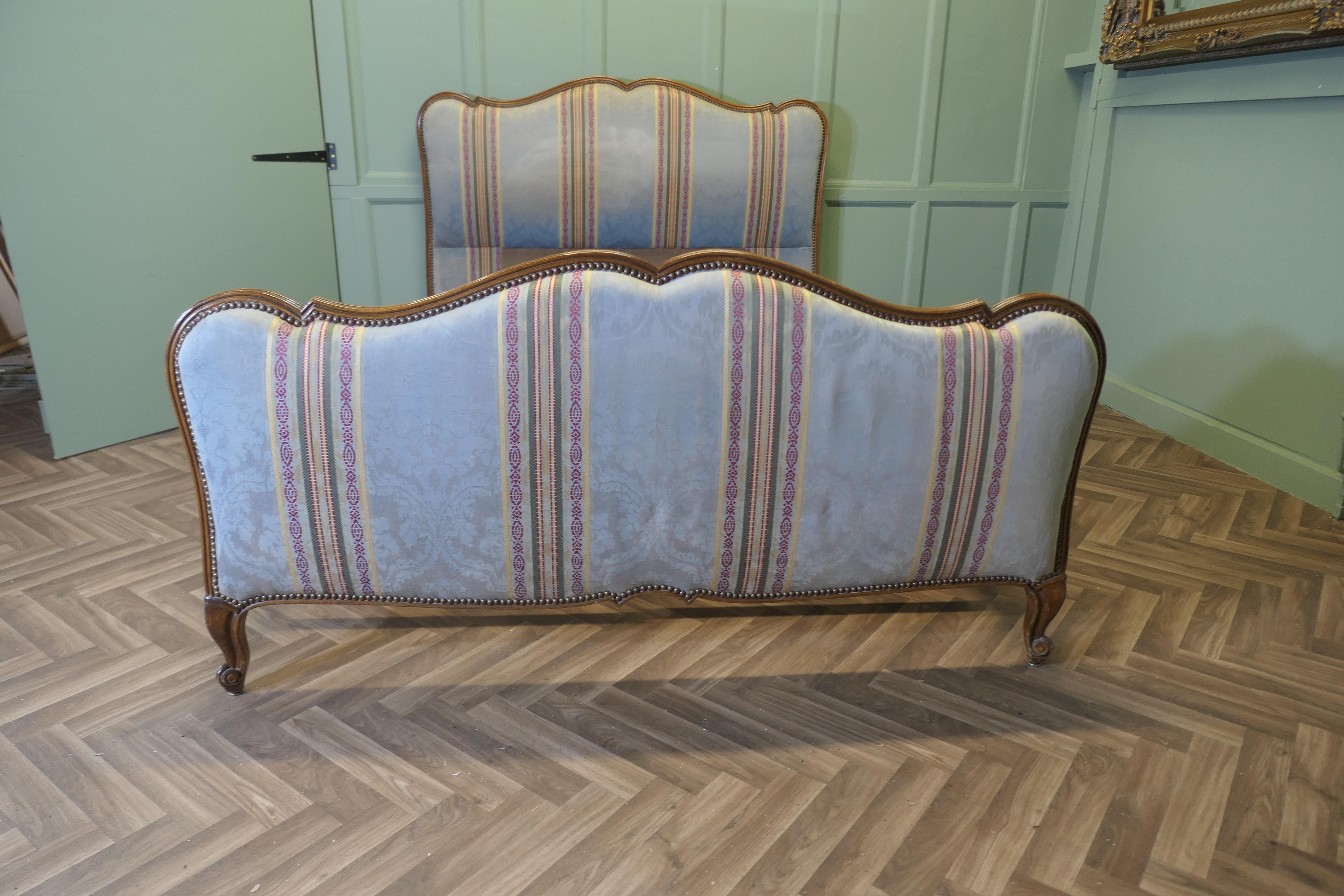 French Upholstered Double Bed 

The Head and foot boards of this bed have a waved top rail, they come in their original jacquard upholstery, which is in delicate blue with embroidered coloured stripes. We have shown the bed with a modern slatted