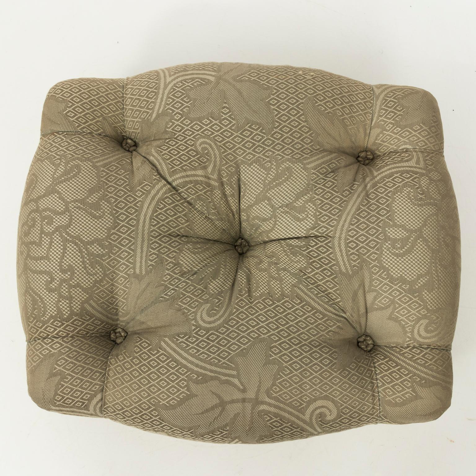 French upholstered ottoman in Celadon damask fabric with tufted buttons, circa 1920.
 