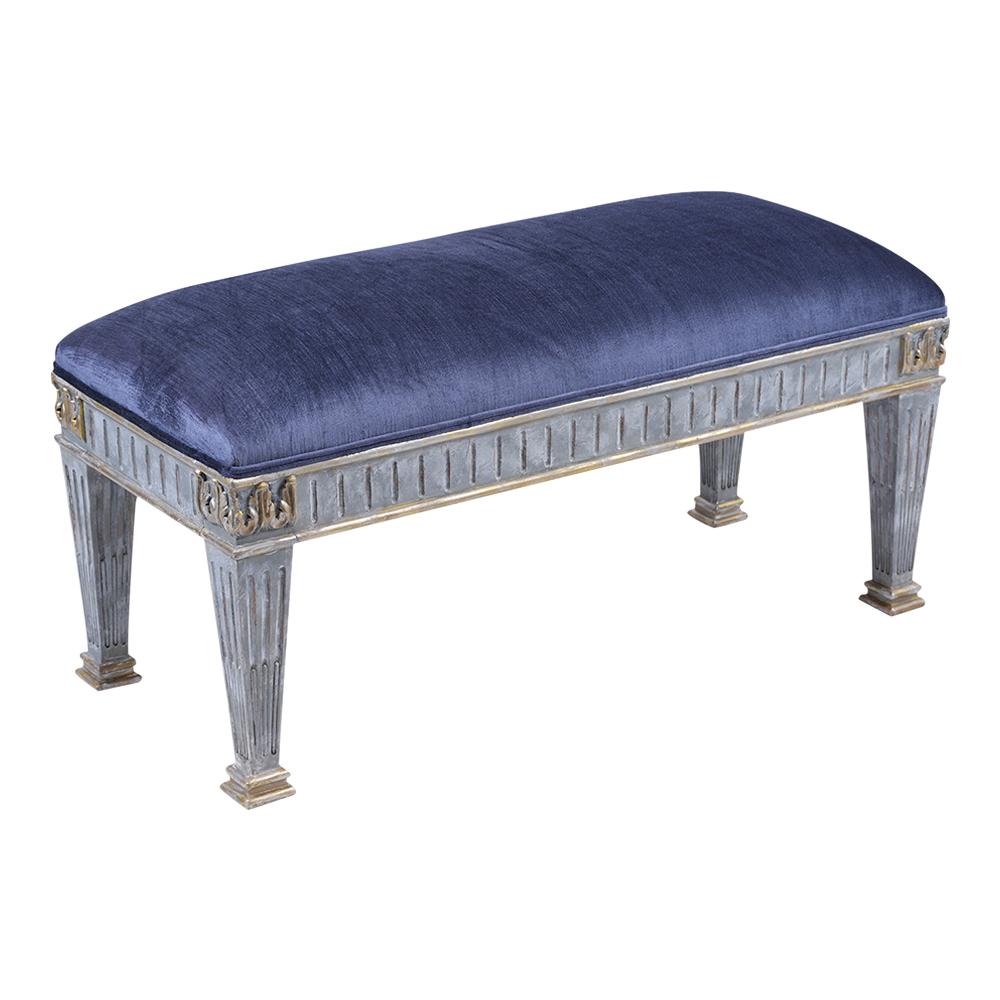 An extraordinary vintage empire-style bench hand-crafted out of mahogany wood has been professionally refinished and upholstered by our team of expert craftsmen. this fabulous piece features a carved frame newly painted in a pale blue with a gilt