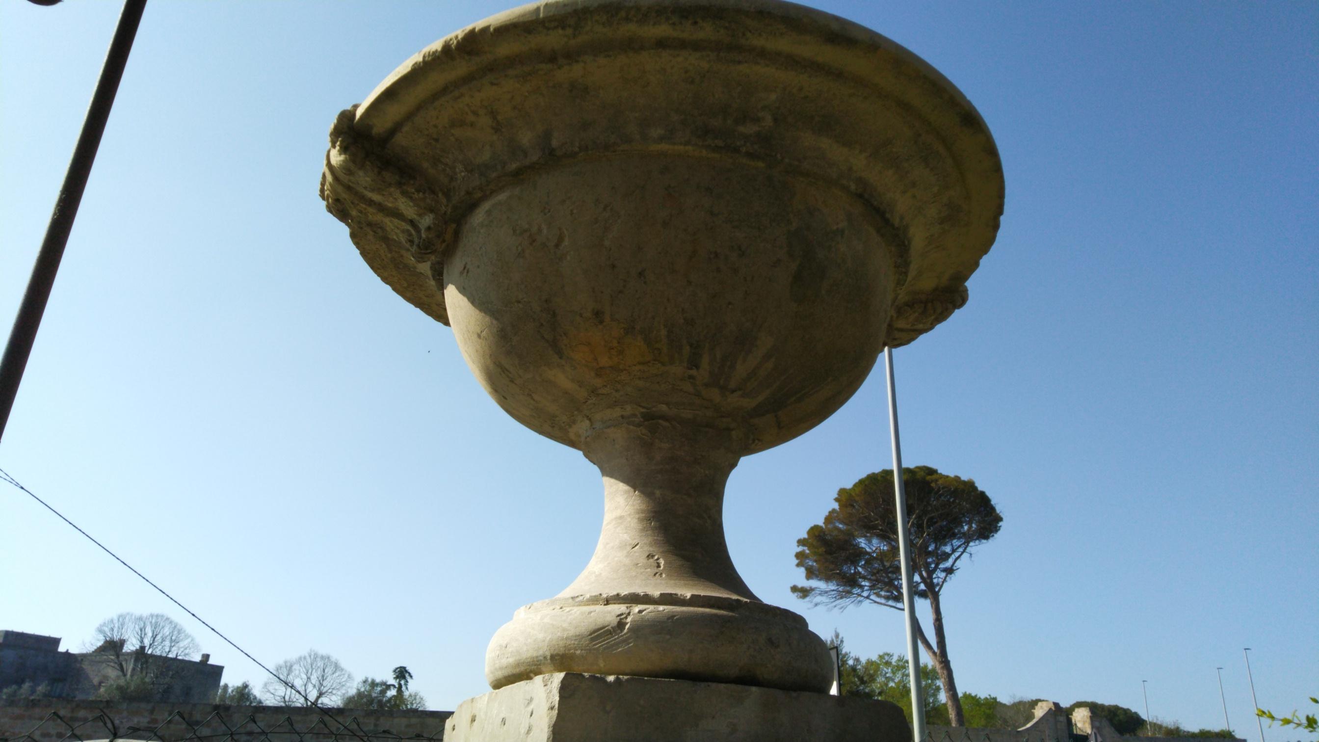 Hand-Carved French Urns with Pedestals 'Pair' Hand-carved in Pure Limestone, antique finish. For Sale