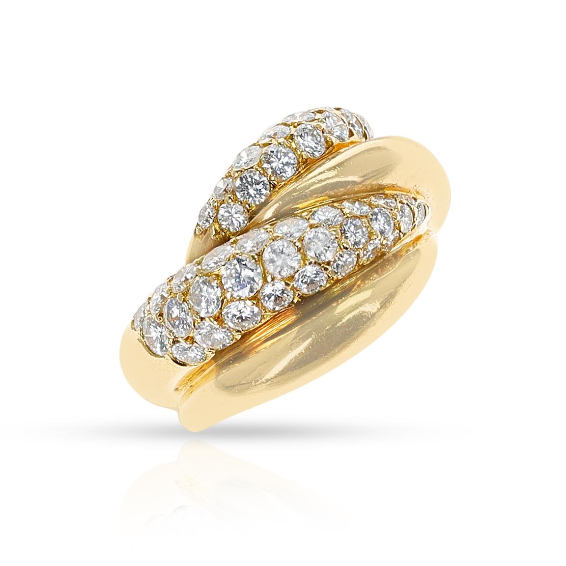 A French Van Cleef & Arpels Gold and Diamond Cocktail Ring made in 18k Gold. The ring has 42 diamonds weighing appx. 1.25 carats. The color is appx. F/G and the clarity is VS1. French Marks. The weight of the ring is 8.50 grams. The ring size is
