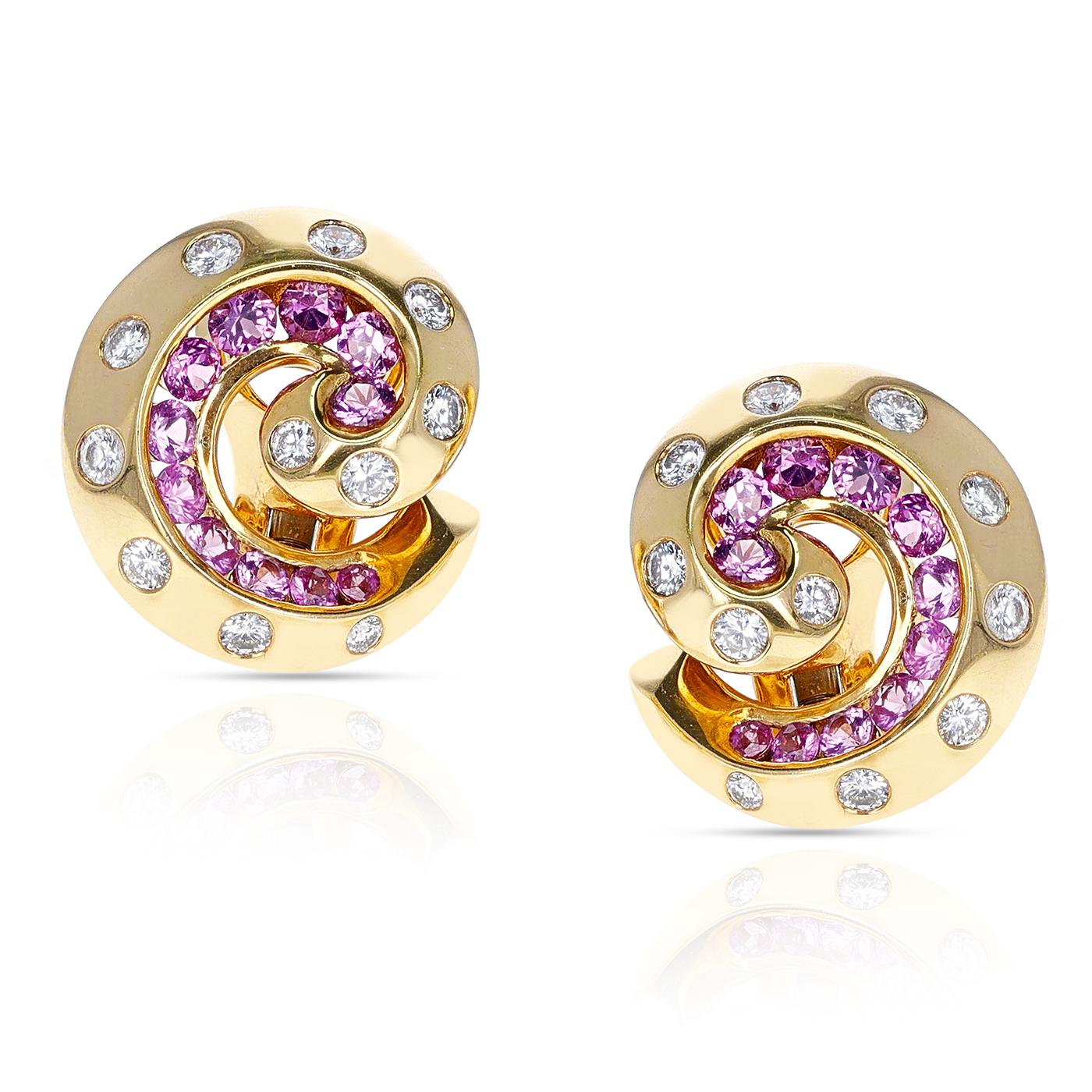 A beautiful French Van Cleef & Arpels Retro Pink Sapphire and Diamond Swirl Earrings made in 18 Karat Yellow Gold. The total weight is 16.98 grams and the dimensions are 7/8
