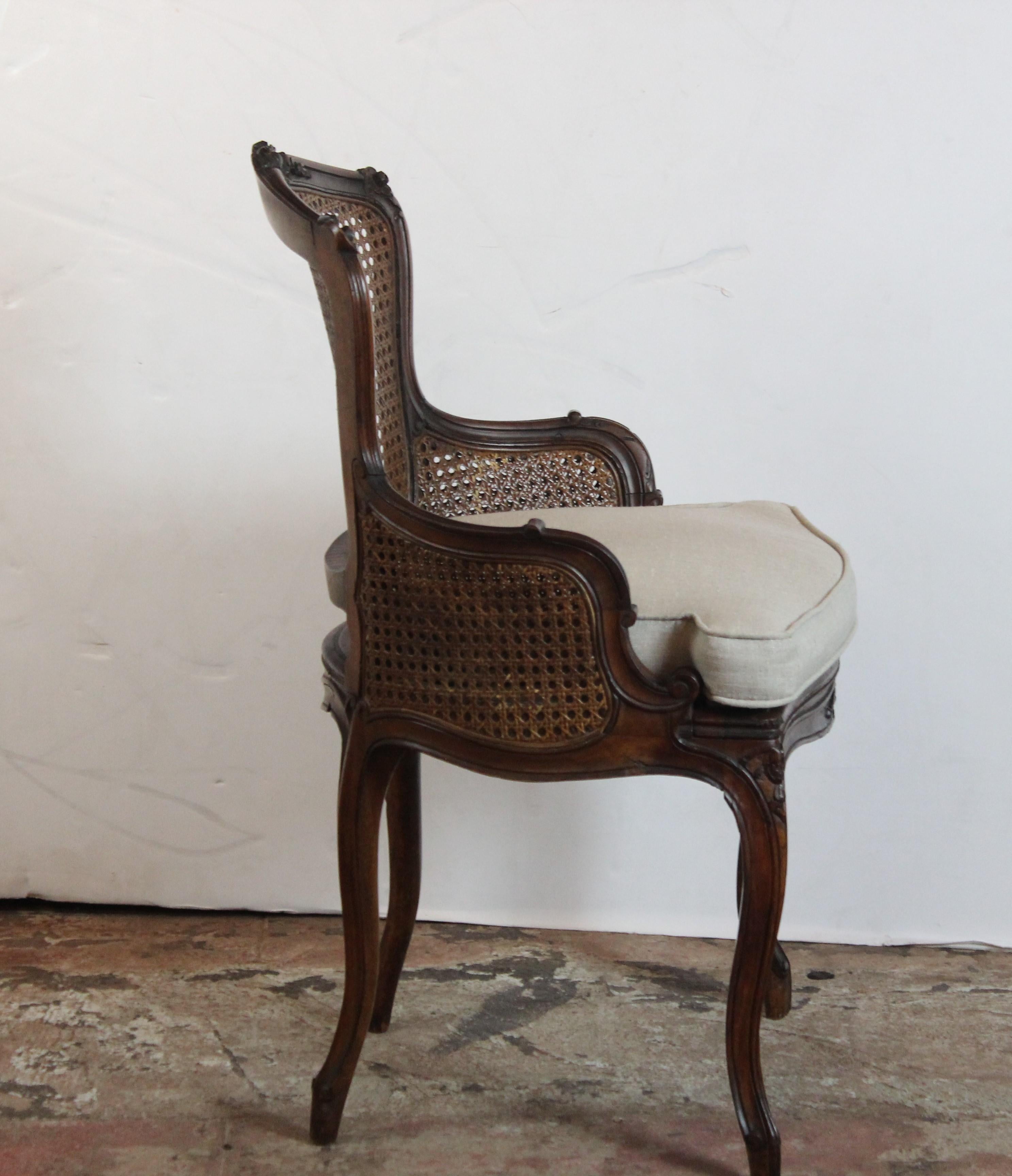 Louis XV style cane back loose cushion vanity chair.