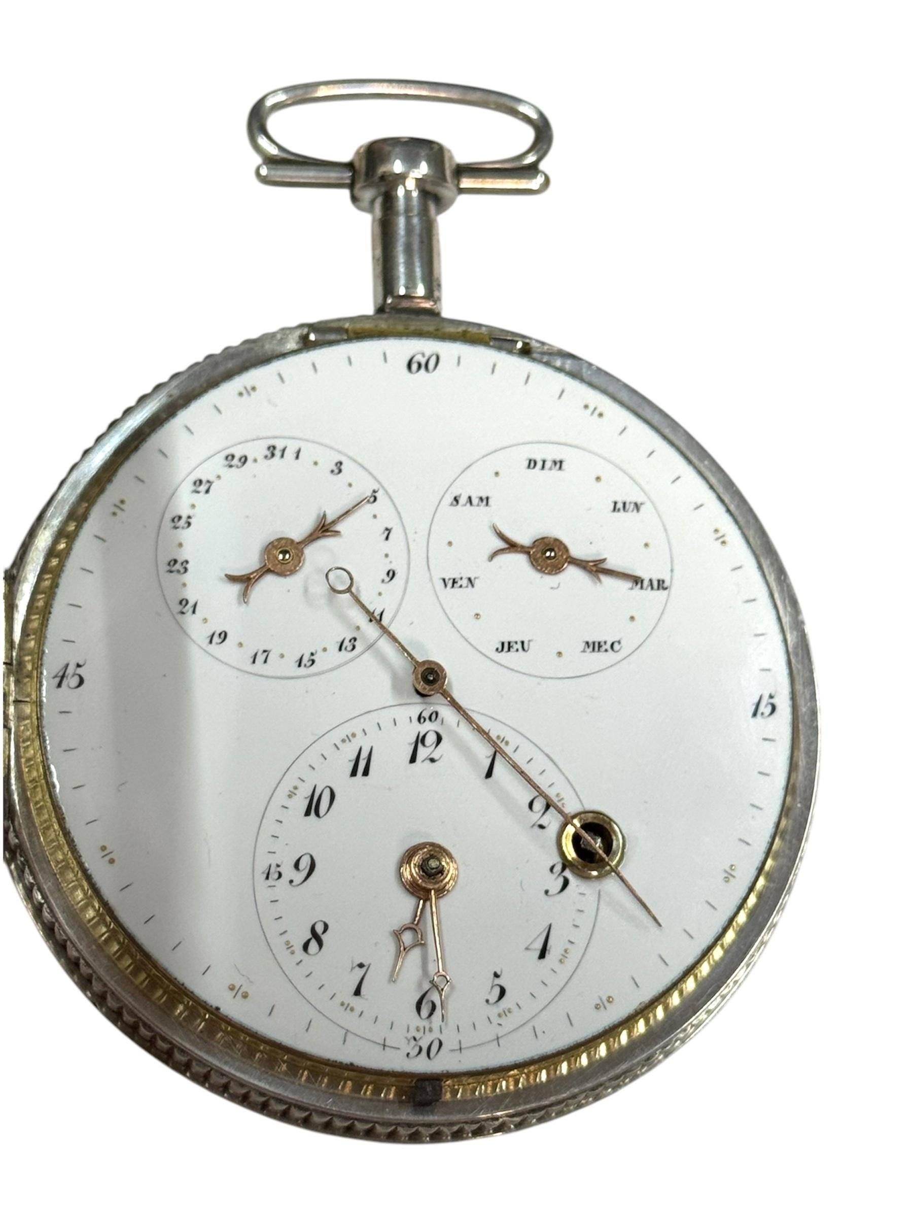The French Verge Fusee Calendar Centre Seconds Pocket Watch is a luxurious timepiece with a mechanical manual movement. This vintage piece, dating back to 1800, features an intricate enamel case with a silver color and a white dial. Made in France
