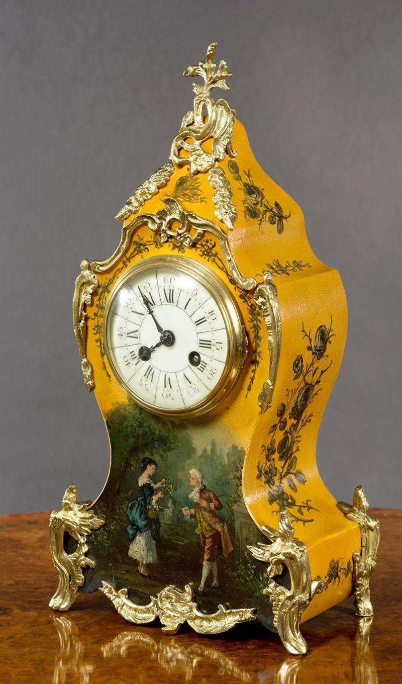 French Vernis Martin mantel clock with ormolu mounts. Beautifully decorated case featuring floral swags and foliage with central lovers scene to the front of the case.
 
Enamel dial with Roman numerals and original ‘blued’ steel hands.
 
Eight