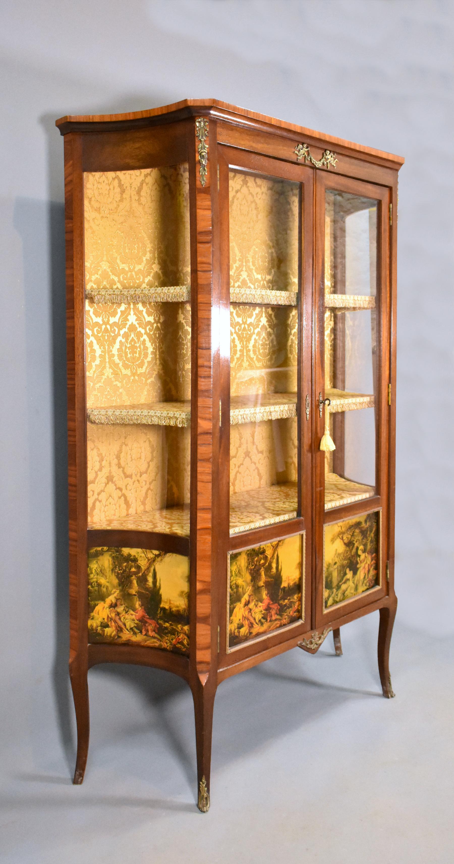 French Vernis Martin style vitrine / display cabinet in walnut and sapele mahogany.

A very pretty vitrine / display cabinet in the style of Vernis Martin, this piece is constructed in sapele mahogany, cross-banded in veneer walnut and decorated
