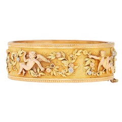 French Victorian 18 Karat Multi-Tone Gold Antique Floral Cherub Bangle Bracelet