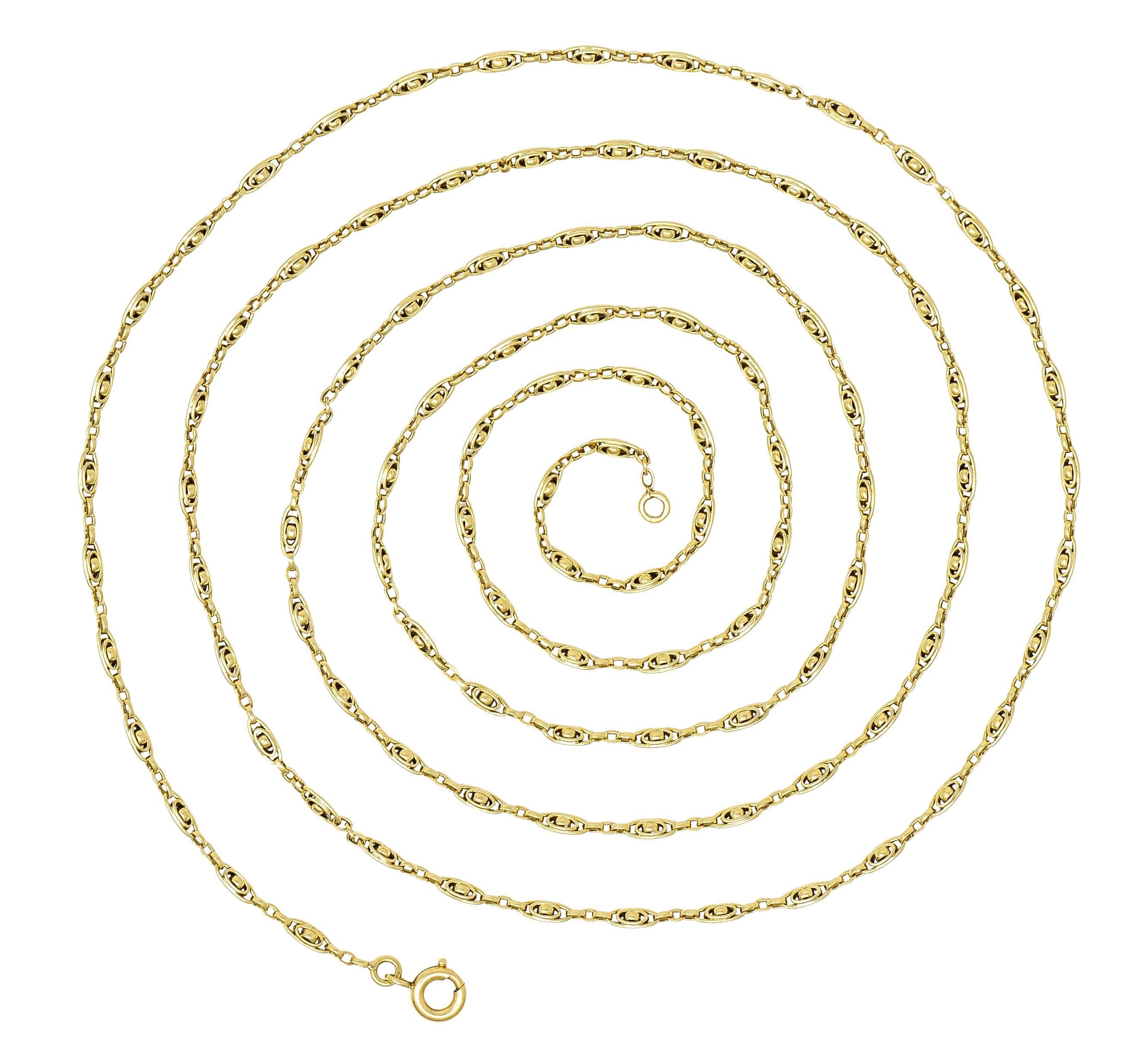 Chain is comprised of oval shaped links. Centering a smaller oval and gold bead. Alternating with oval shaped cable chain. Completed by large spring clasp closure. Stamped with French hallmarks for 18 karat gold. Circa: 1840's. Length: 58 1/2
