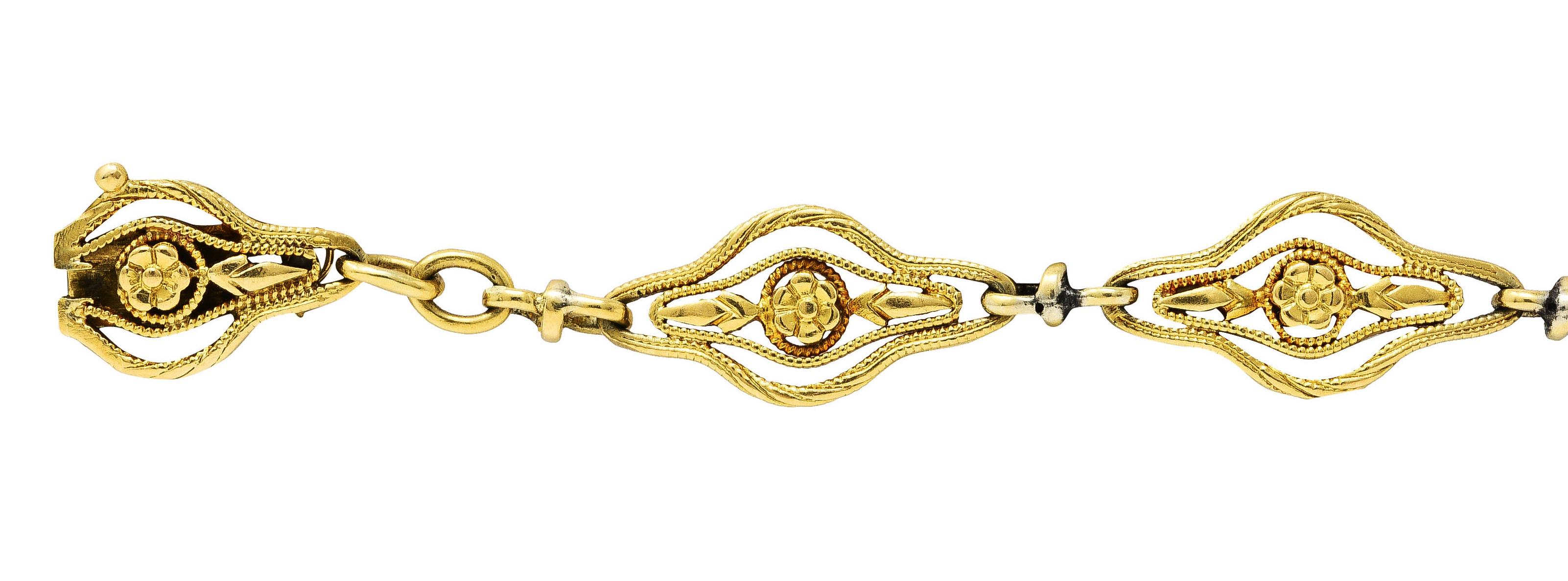 Bracelet is comprised of highly decorative navette links

With floral motif and milgrain wire

Separated by split oval spacer links

Completed by hidden clasp with safety chain and figure eight safety

With French assay marks for 18 karat gold

With