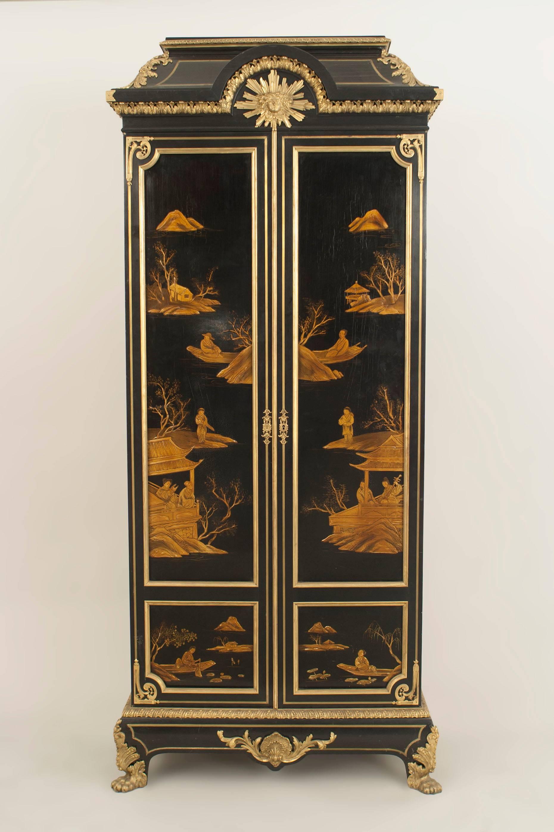 French Victorian (19/20th Century) 2 door black lacquered chinoiserie decorated armoire cabinet with bronze trim.

