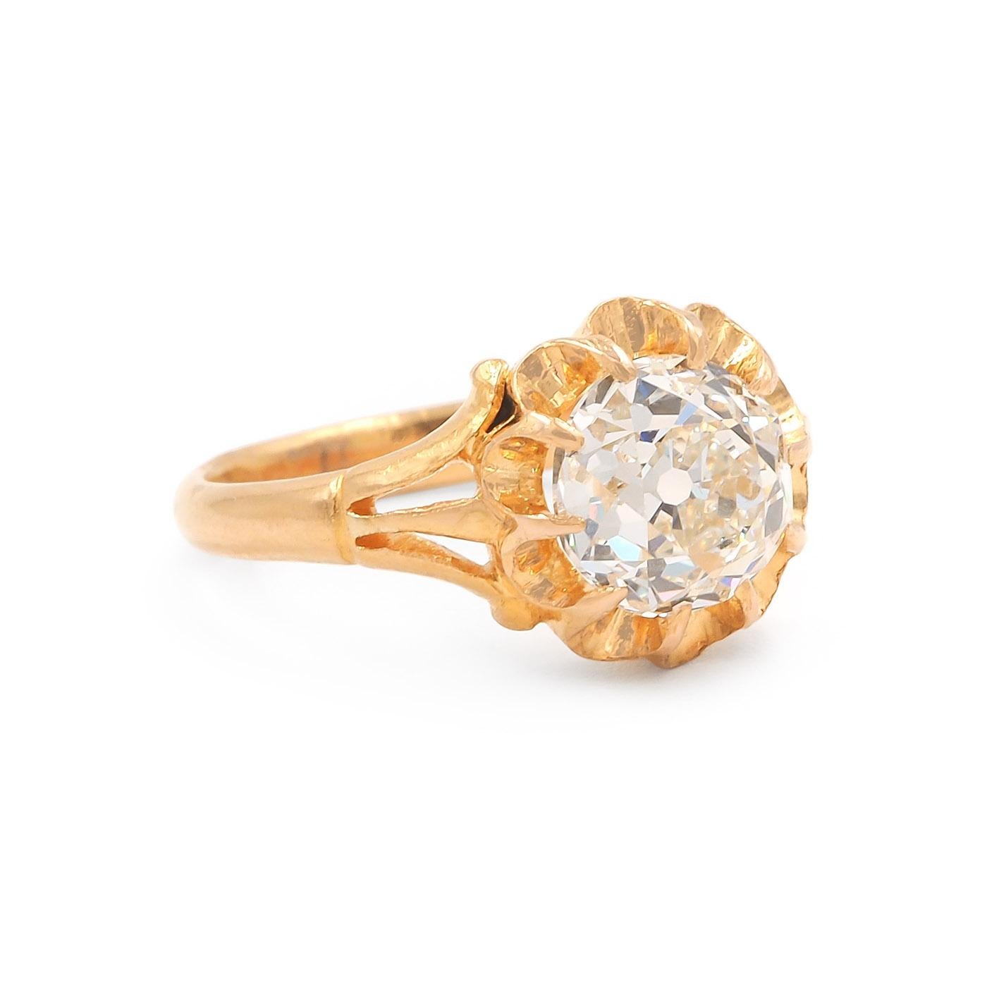 French Victorian Era Old European Cut Diamond Solitaire Engagement Ring composed of 18k yellow gold. The center stone 2.43 carat Old Mine Cut diamond is GIA certified L color & VS2 clarity. The diamond is set in a buttercup style setting, within