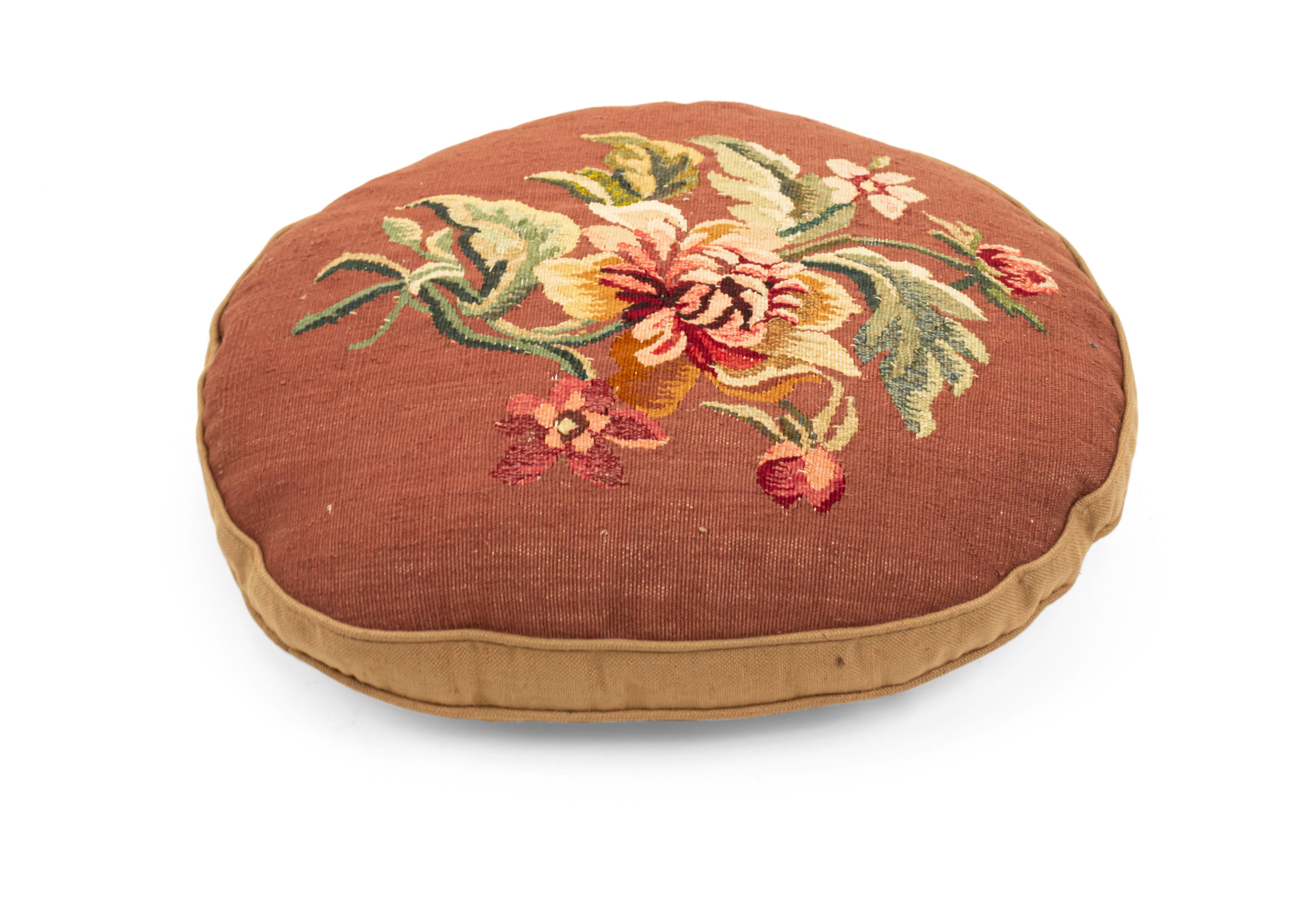 French Victorian oval shaped aubusson cushion with brown background and floral design.
 