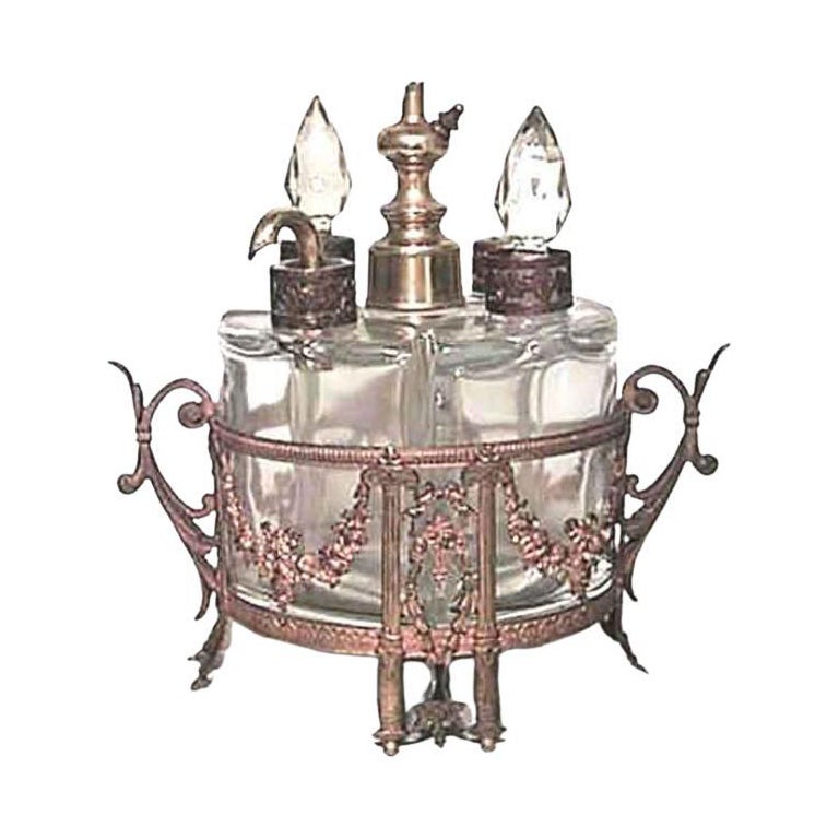 Juego victoriano francés de frascos de perfume de bronce y cristal