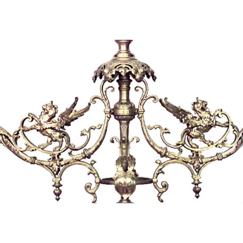 Apparecchio da biliardo francese vittoriano in bronzo dorato a 3 luci con grifoni alati e 3 paralumi in vetro colorato.

Diametro del paralume 10