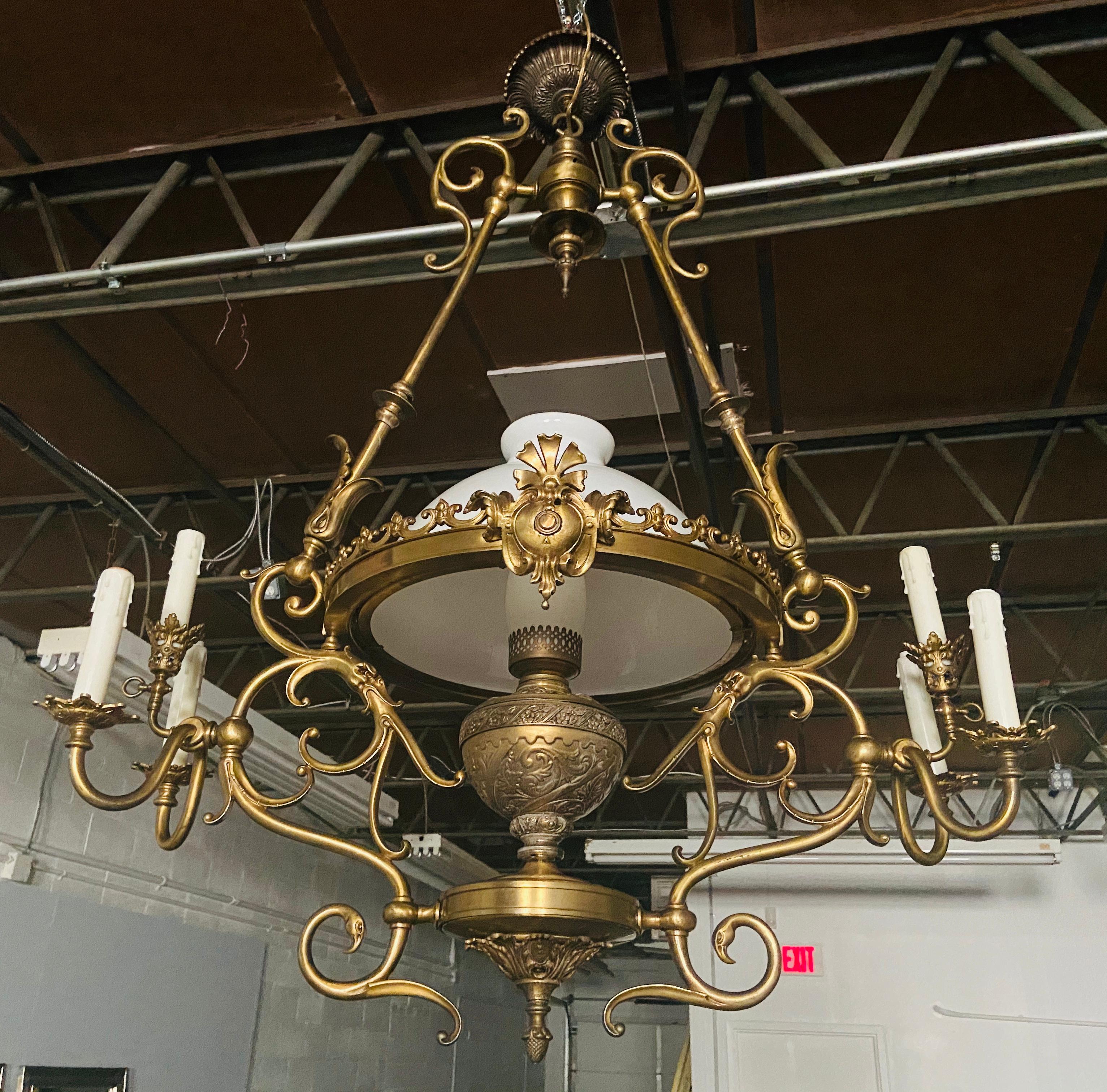 French Victorian bronze gas light chandelier
This elegant Victorian bronze gas light chandelier features fine details and 7 lights. Each side has three lights setting on three foliate detailed arms.
The center oil fount converted to a center light