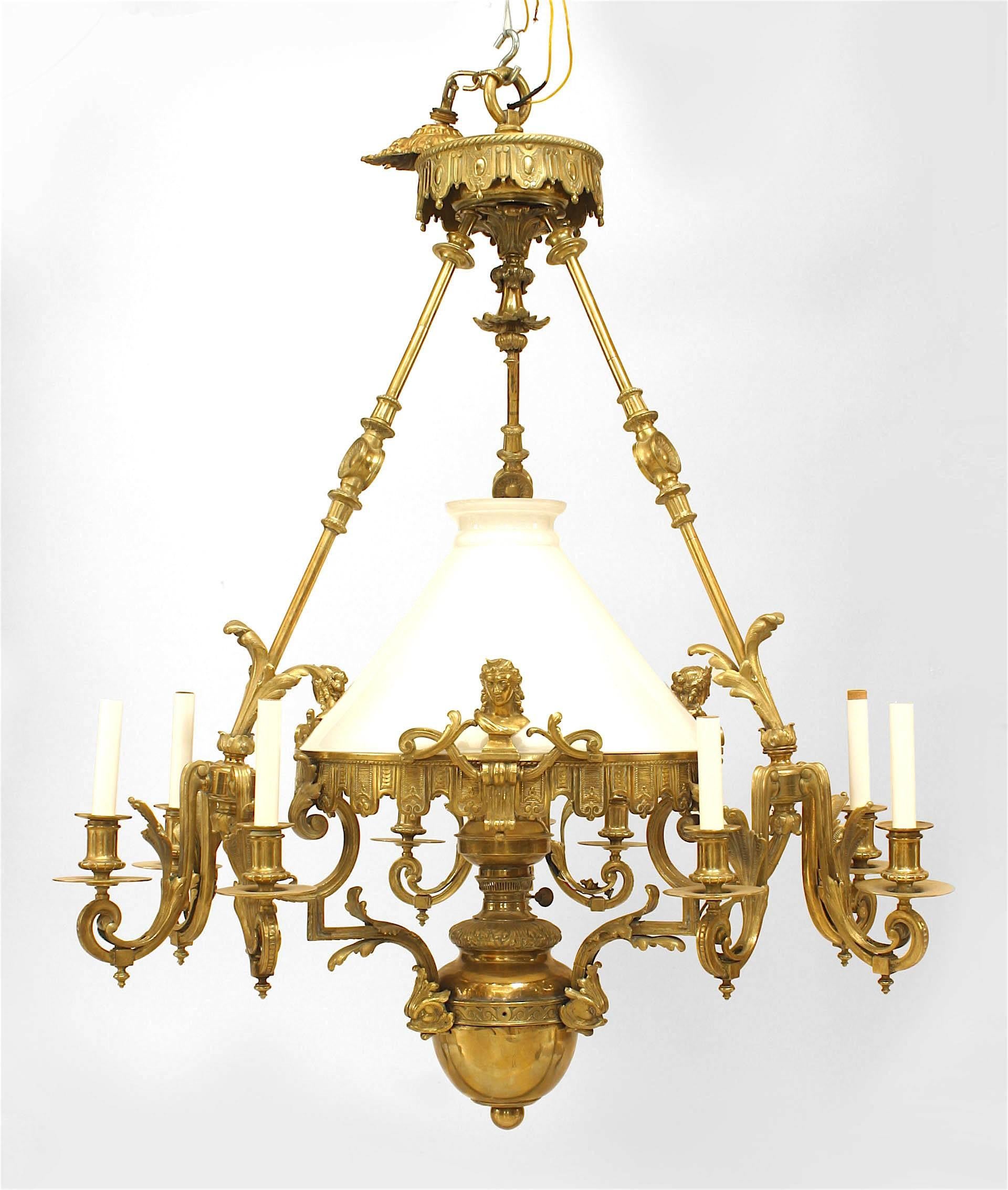 French Victorian bronze 9 light converted gas chandelier with 3 lights on 3 foliate detailed arms with white glass center shade covering a center oil fount.
