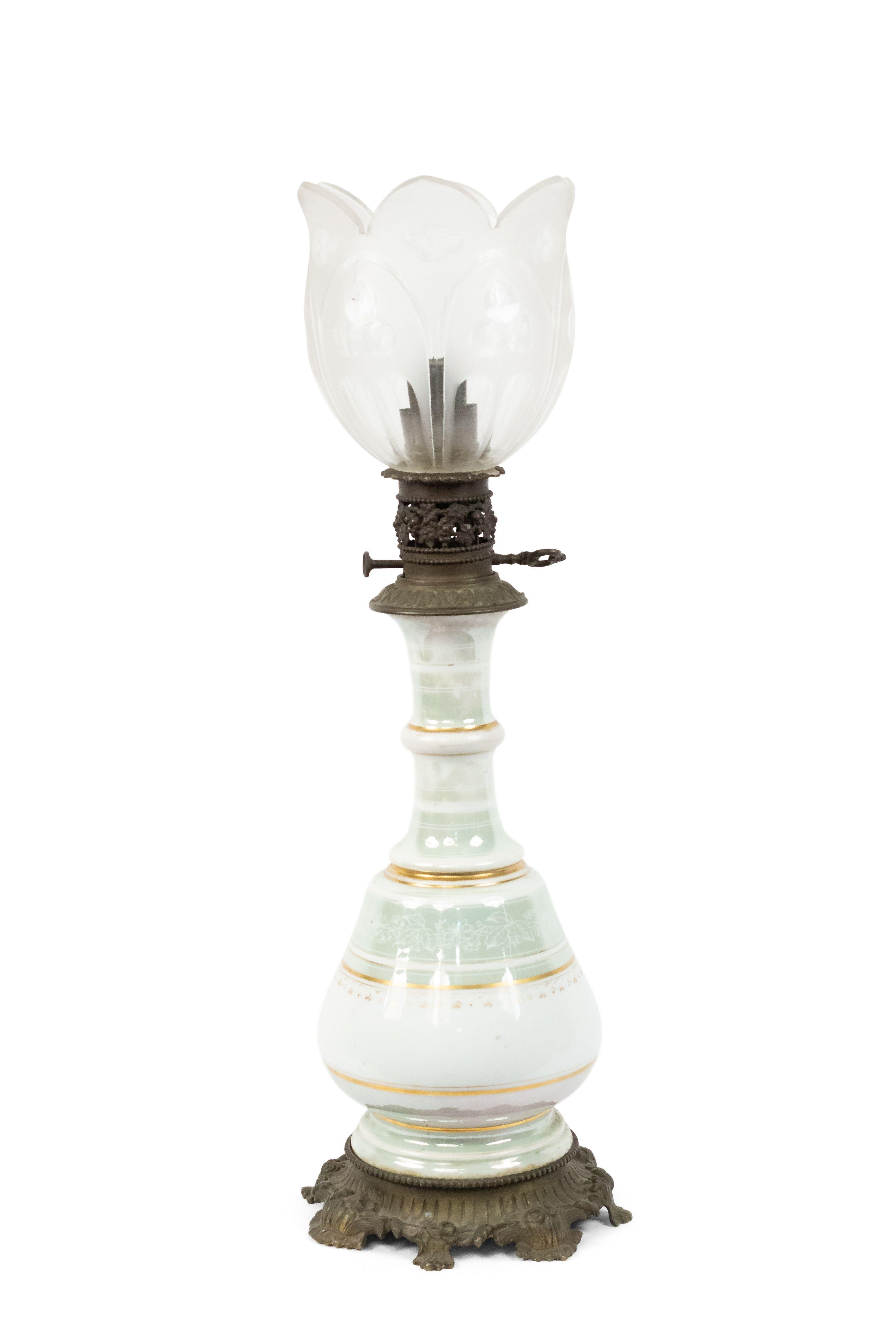 Pair of French Victorian celadon and white porcelain oil lamps with etched glass shade and bronze base (PRICED AS Pair).
