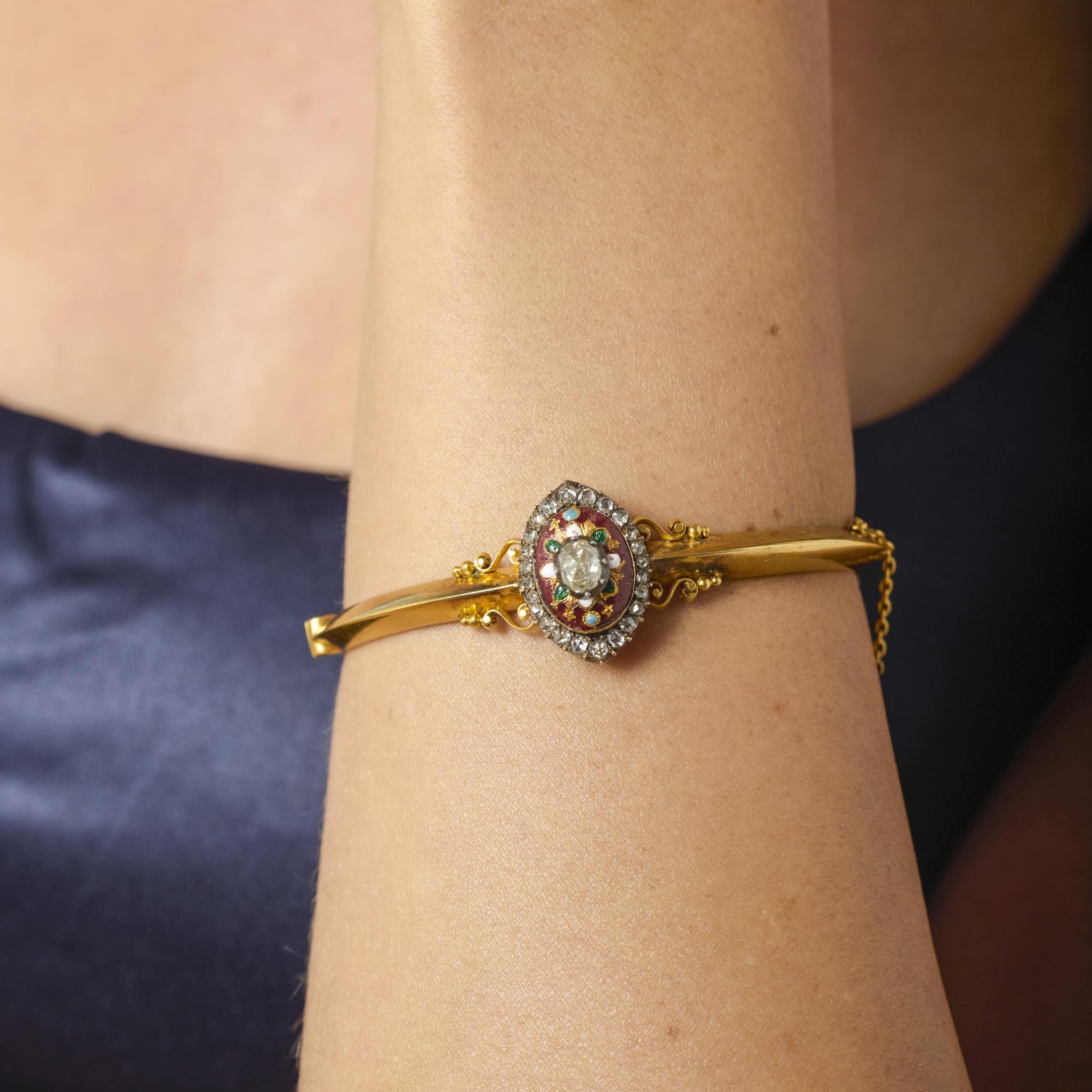 A magnificent example of 19th-century French craftsmanship, this Victorian bracelet glows with the romance and refinement of a bygone era. A luminous rose cut diamond anchors the design, framed by a constellation of twenty-five smaller rose cuts