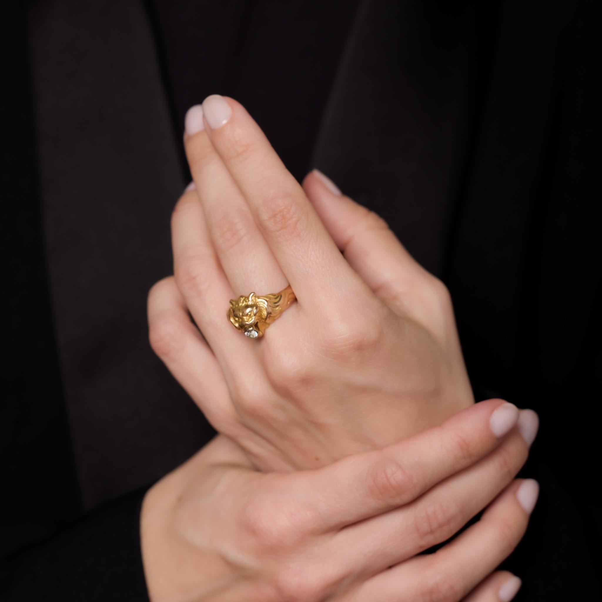 This French Victorian lion ring is crafted in 18k yellow gold and features an old European cut diamond weighing approximately .25 carats, I-J color, and VS clarity. Hallmarked with the French eagle head and maker’s mark, it dates to the 1890s and