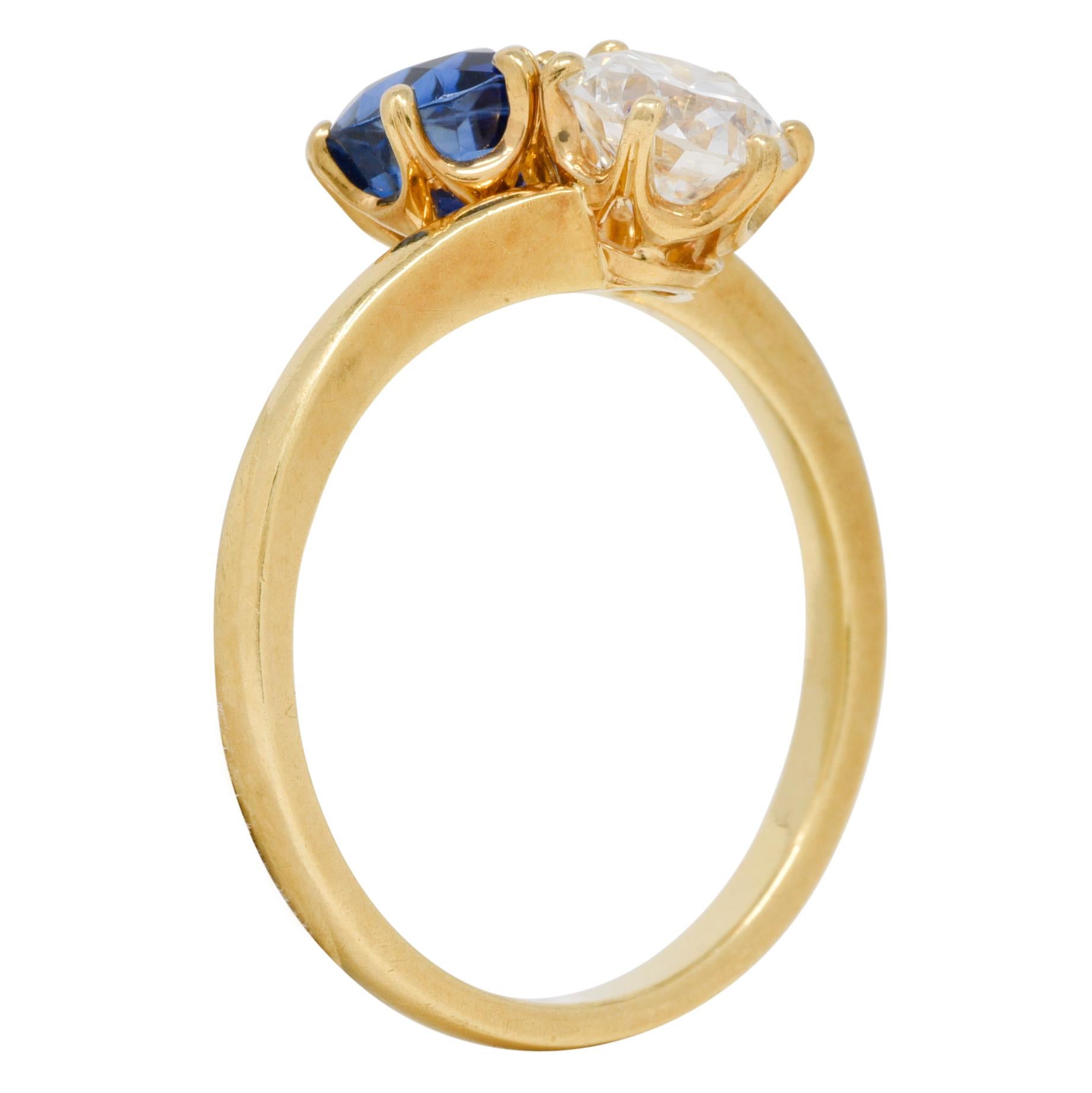 Designed as a toi-et-moi style bypass ring terminating with an old European cut diamond and a round cut sapphire
Diamond weighs approximately 0.82 carat - G color with VS2 clarity
Sapphire weighs approximately 1.22 carat total - transparent medium