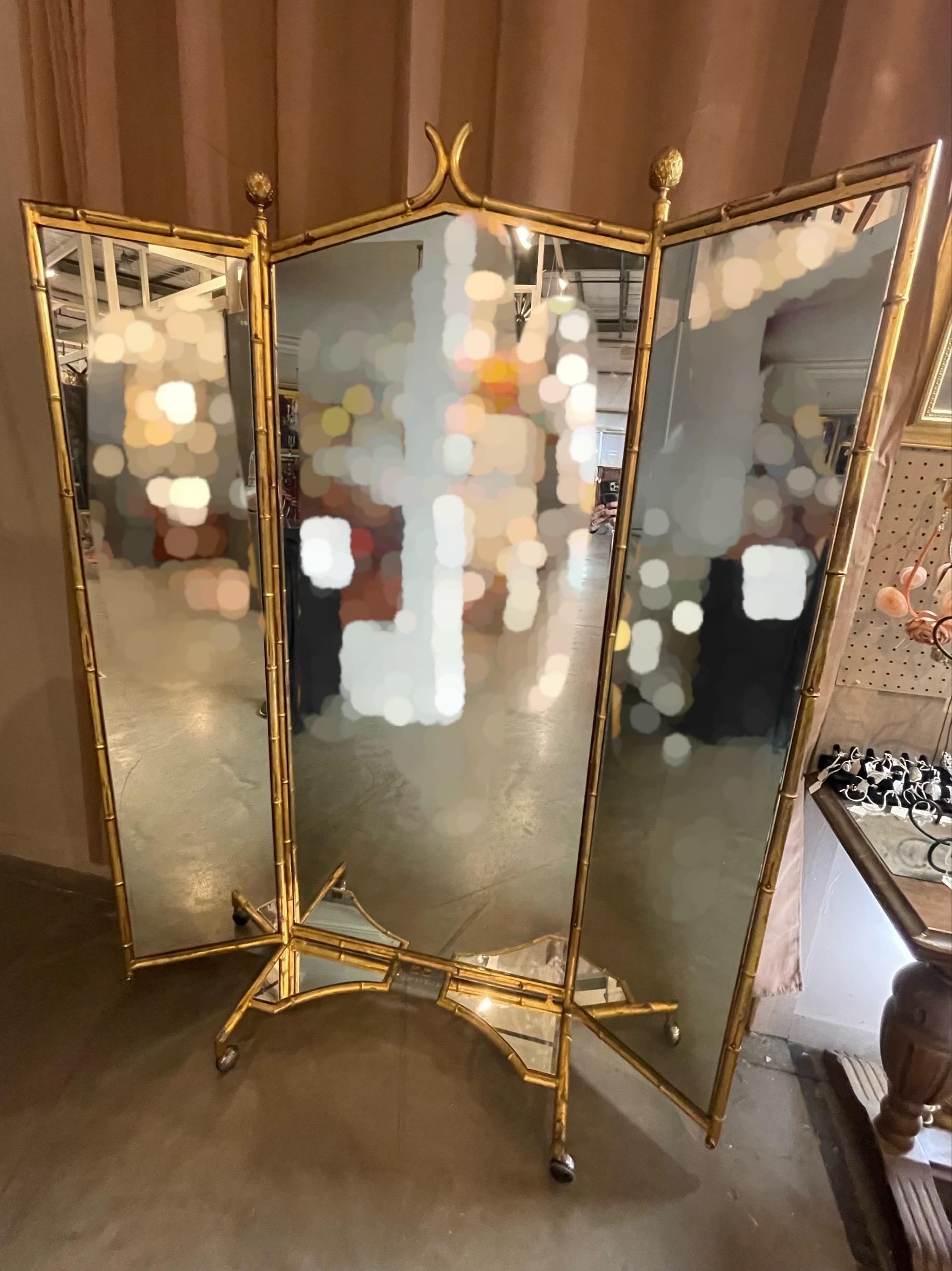 French Victorian faux bamboo gold three-way (triptych) cheval mirror.

Brass tryptych dressing mirror from the renowned company of Miroir Brot of Paris. The solid brass framed mirrors, bear the Brot label. The three mirrors are housed in painted
