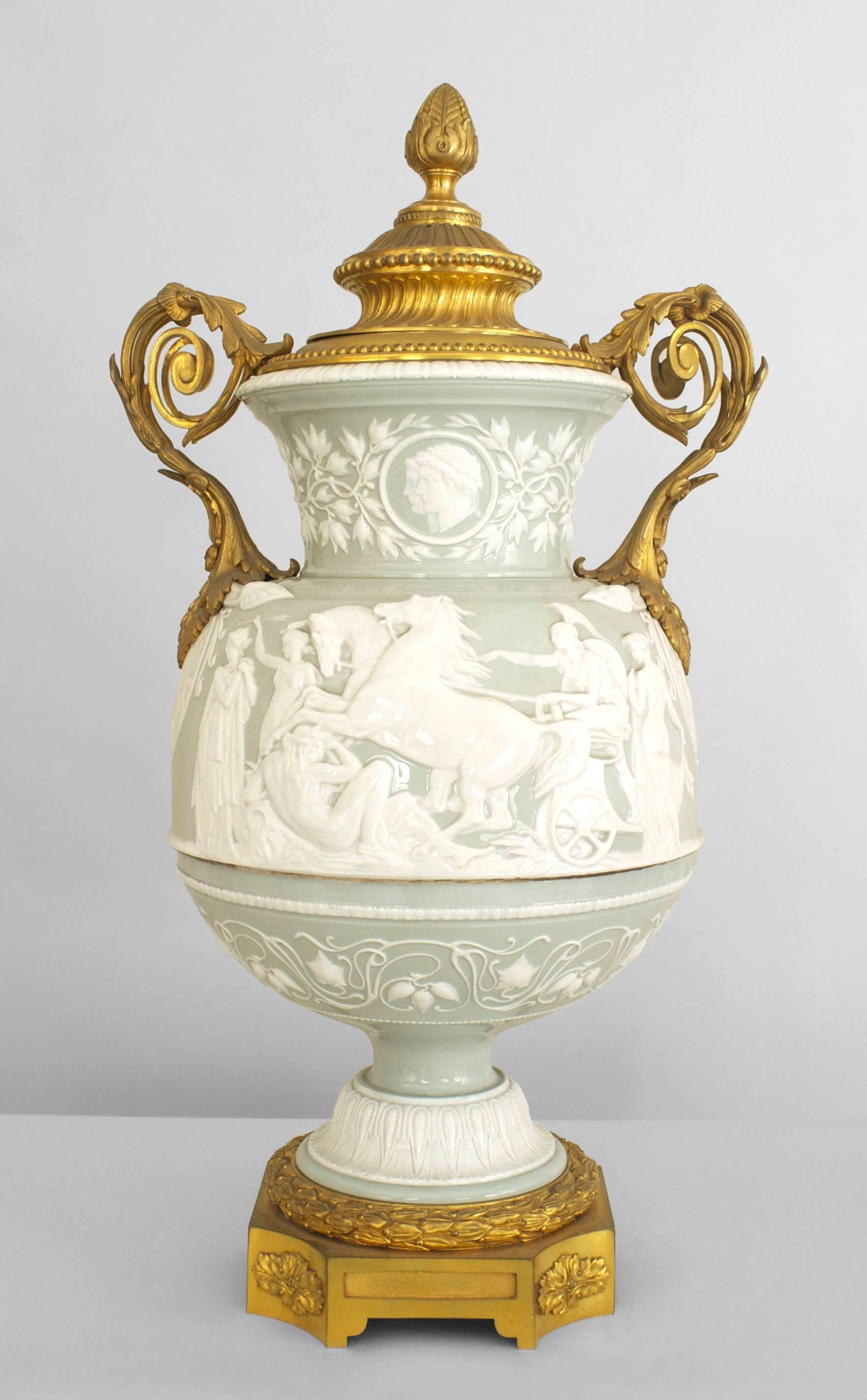 French Victorian large celadon & white porcelain palace vase with classical figures, bronze trim base and handles.
