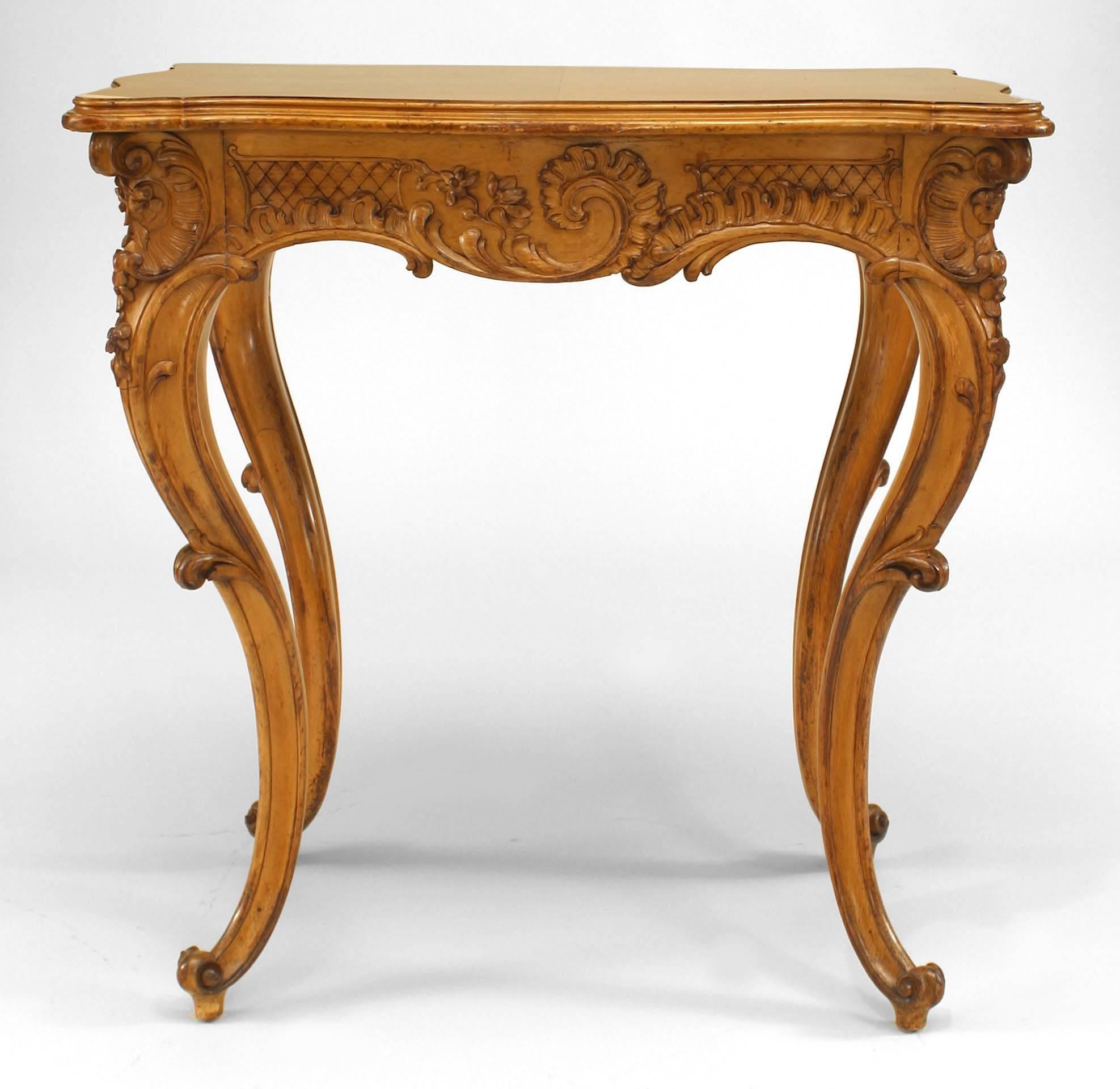 French Victorian rectangular shaped maple four-legged end table with side slides and carved apron.
 