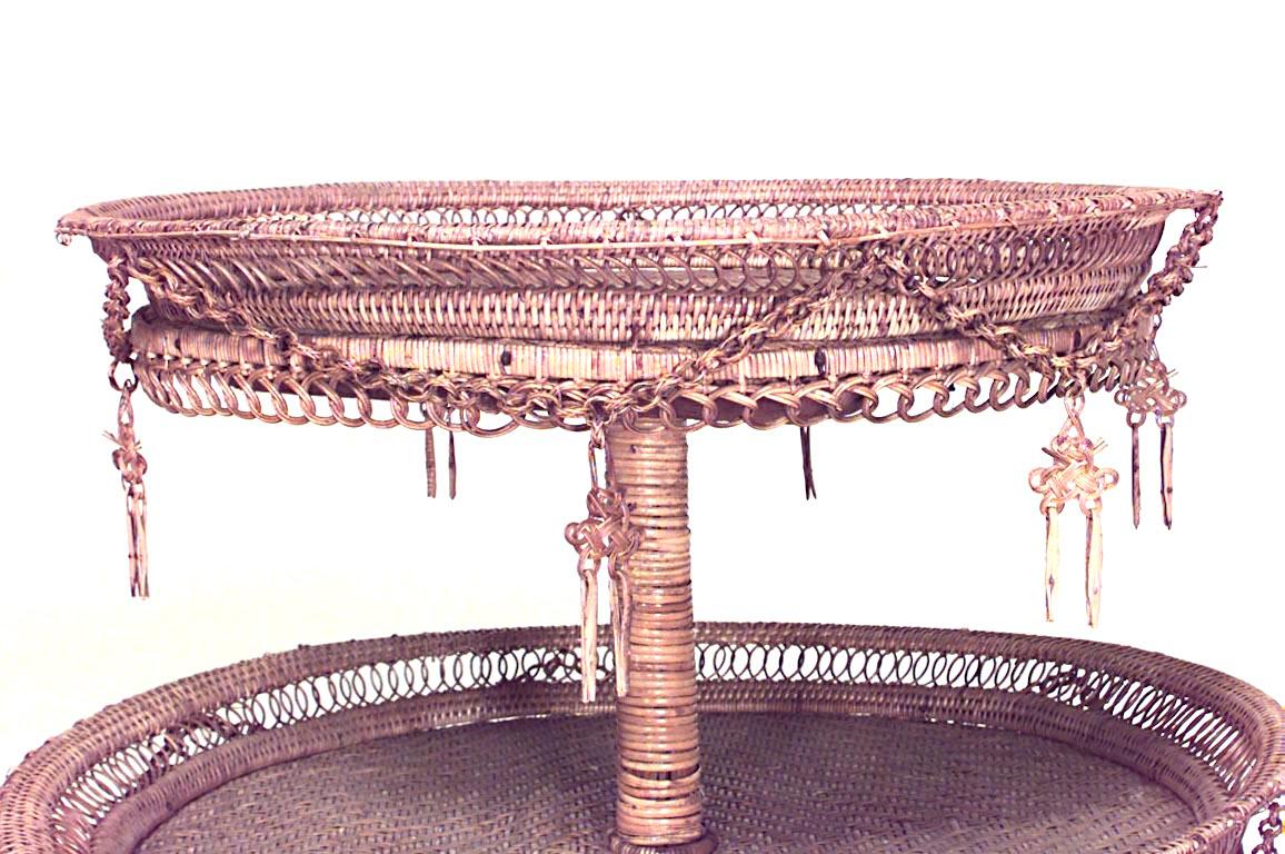 French Victorian natural wicker round three tier table with four scroll legs and filigree galleries.
