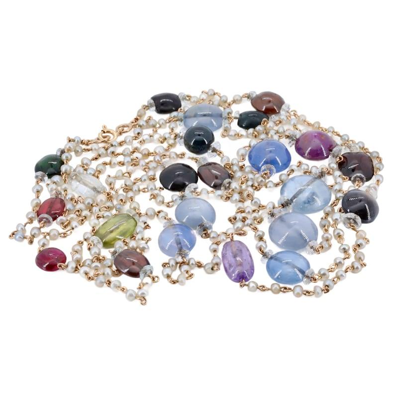 Aston Estate Jewelry Presents:

A French made, victorian period natural sapphire and pearl necklace in 18 karat gold. Set with sapphires encompassing the full rainbow of color. Featuring a variety of bright vivid blue, purple, pink, green, rich