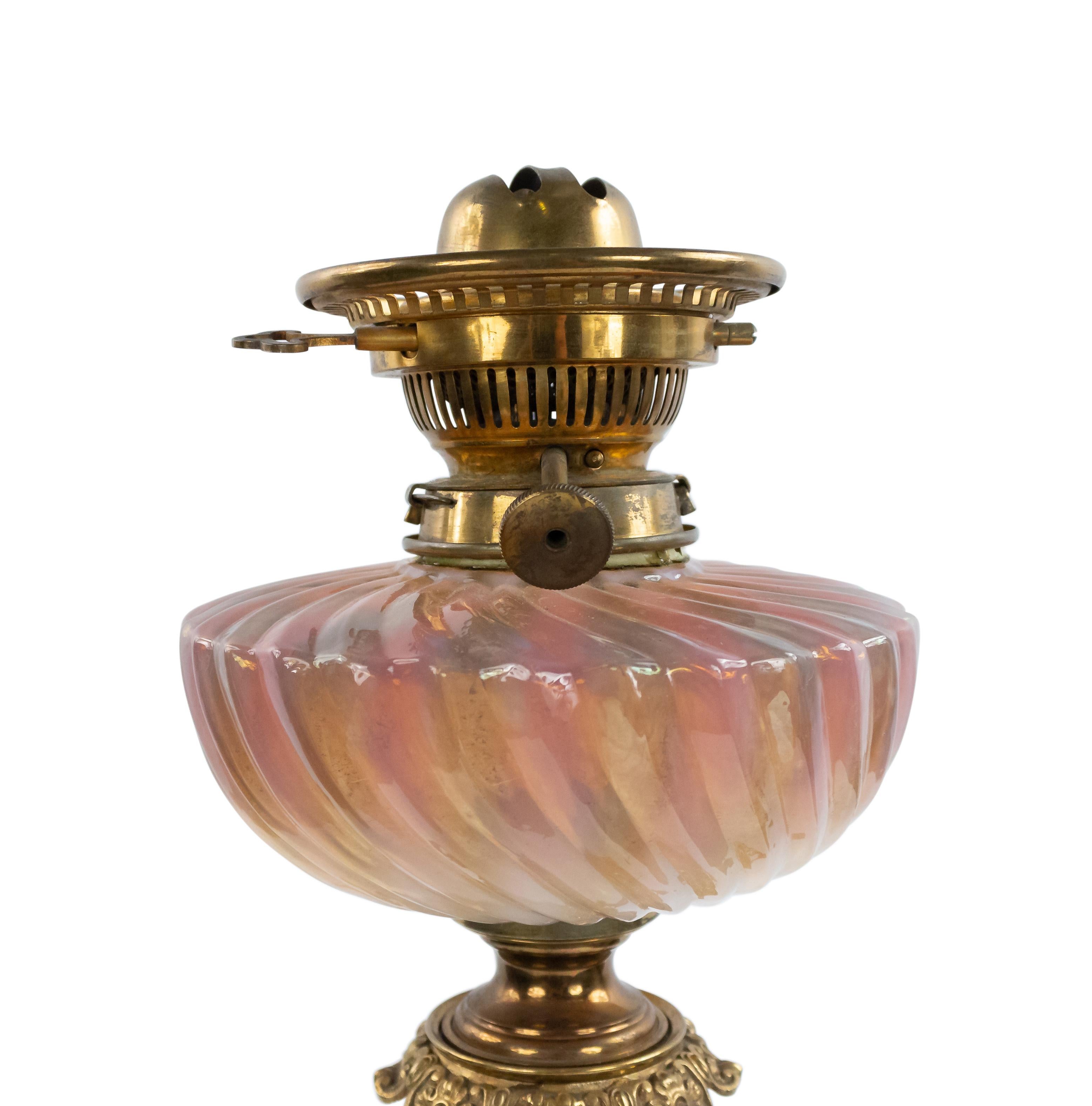 Pair of French Victorian pink and white Sevres porcelain oil lamps with bronze trim (Missing shades) (PRICED AS Pair).
