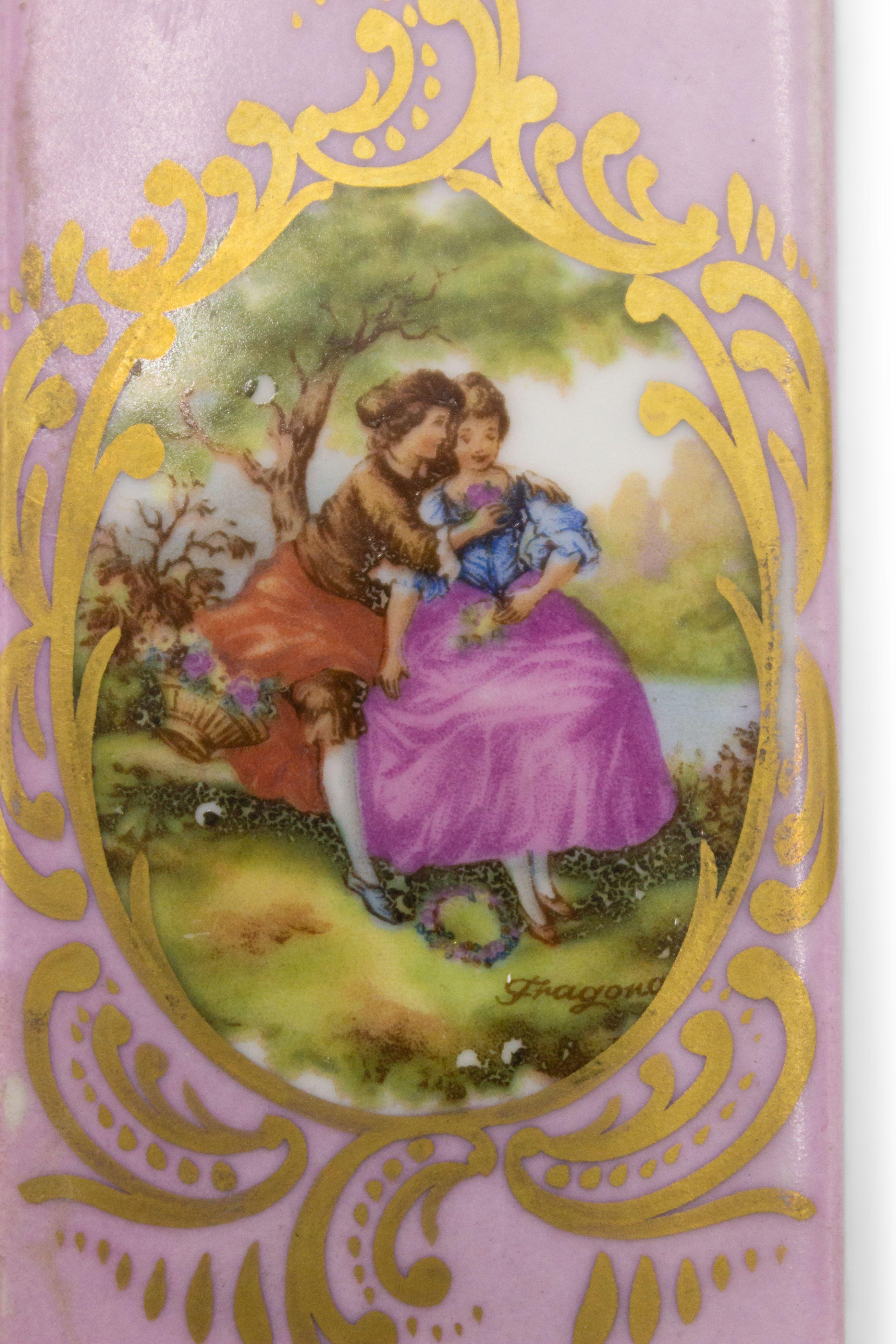2 French Victorian style (19/20th Century) pink and gilt trim porcelain wall plaques door push with scene of 18th Century figures. (PRICED EACH).
 