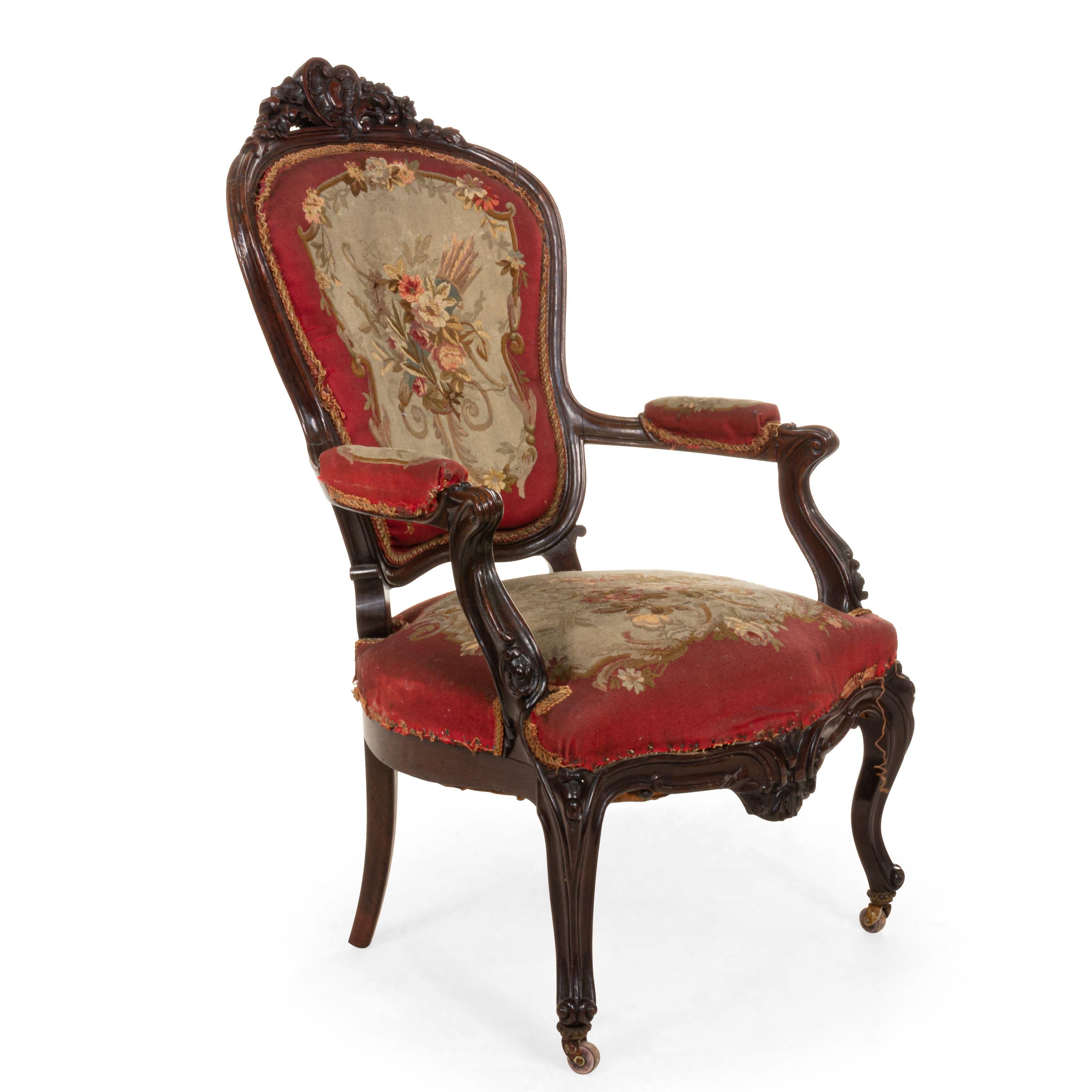 Pair of French Victorian rosewood armchairs with carved back crest rail and red floral Aubusson upholstery. (similar to #038110C).