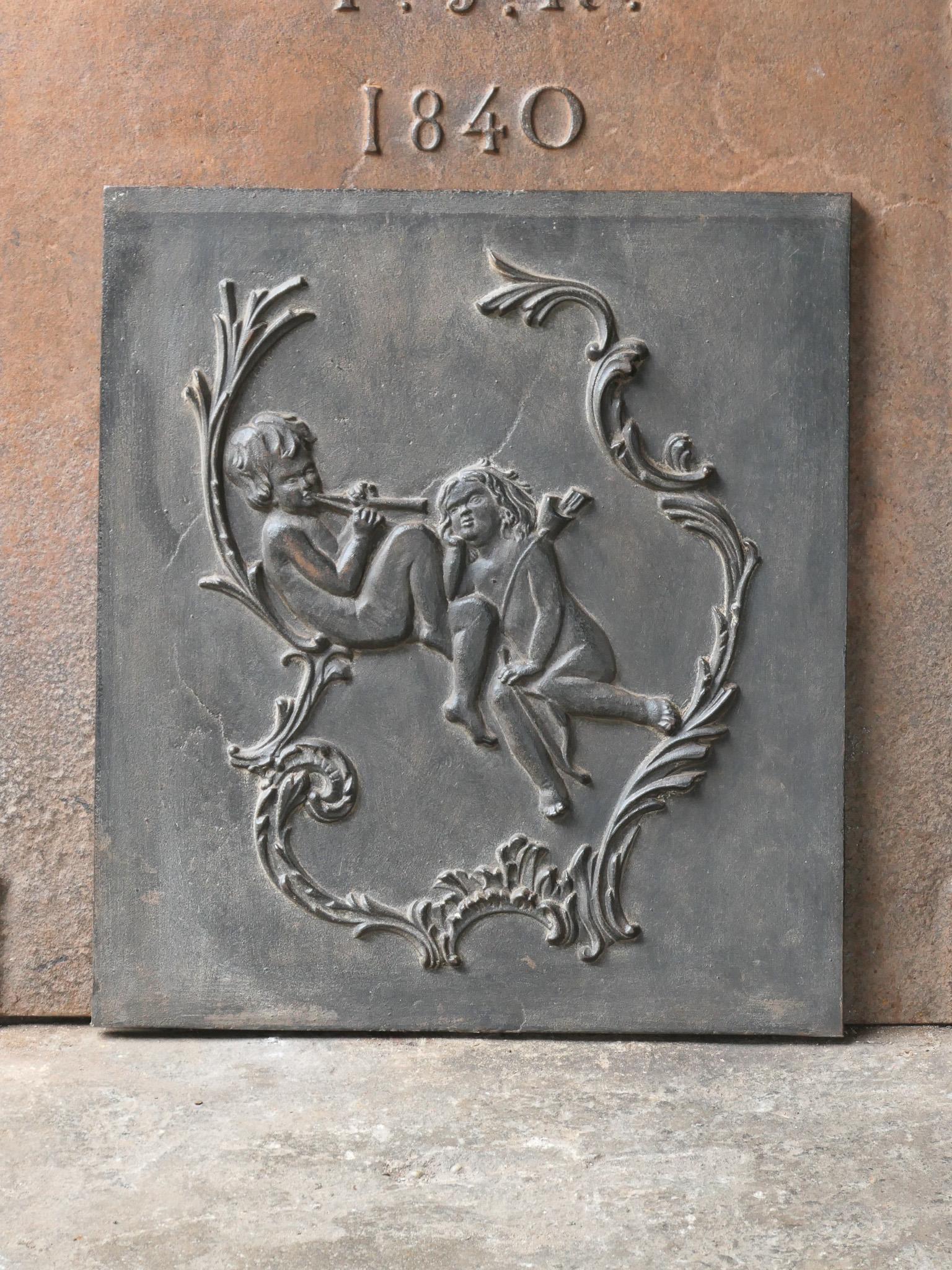 20th century French fireback with an allegory of love. 

The fireback is made of cast iron and has a natural brown patina. Upon request it can be made black / pewter at no extra cost. It is in a good condition and does not have cracks.

