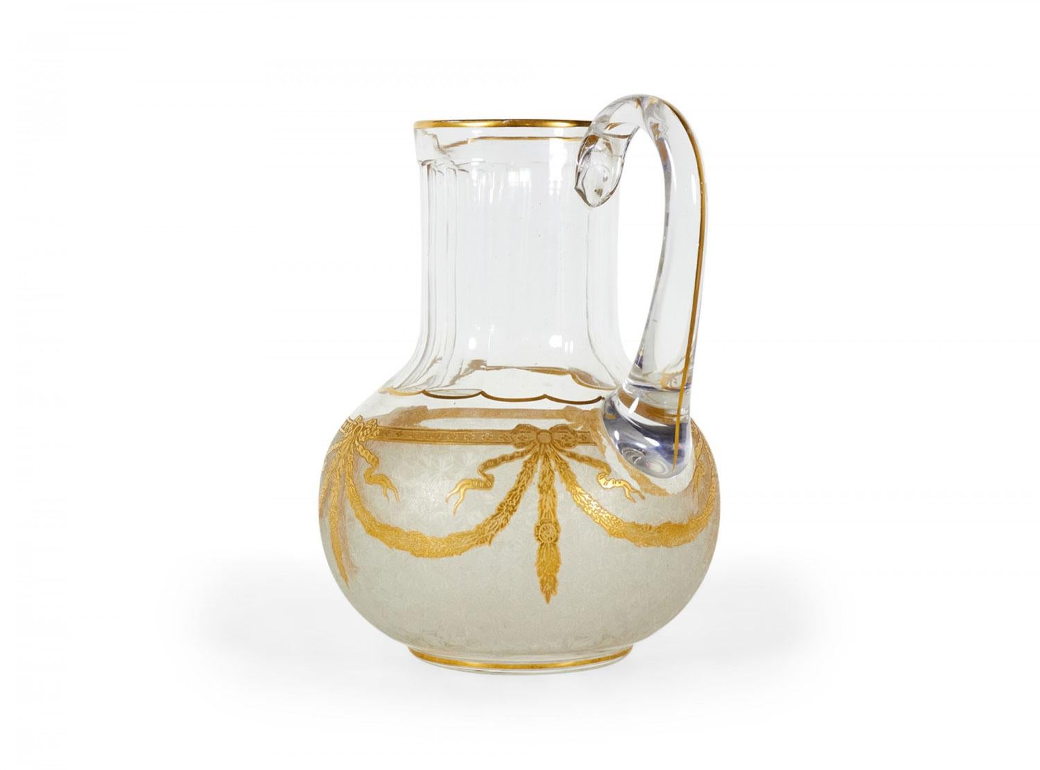 French Victorian-style (20th Century) Baccarat crystal pitcher with gilt festoon design.