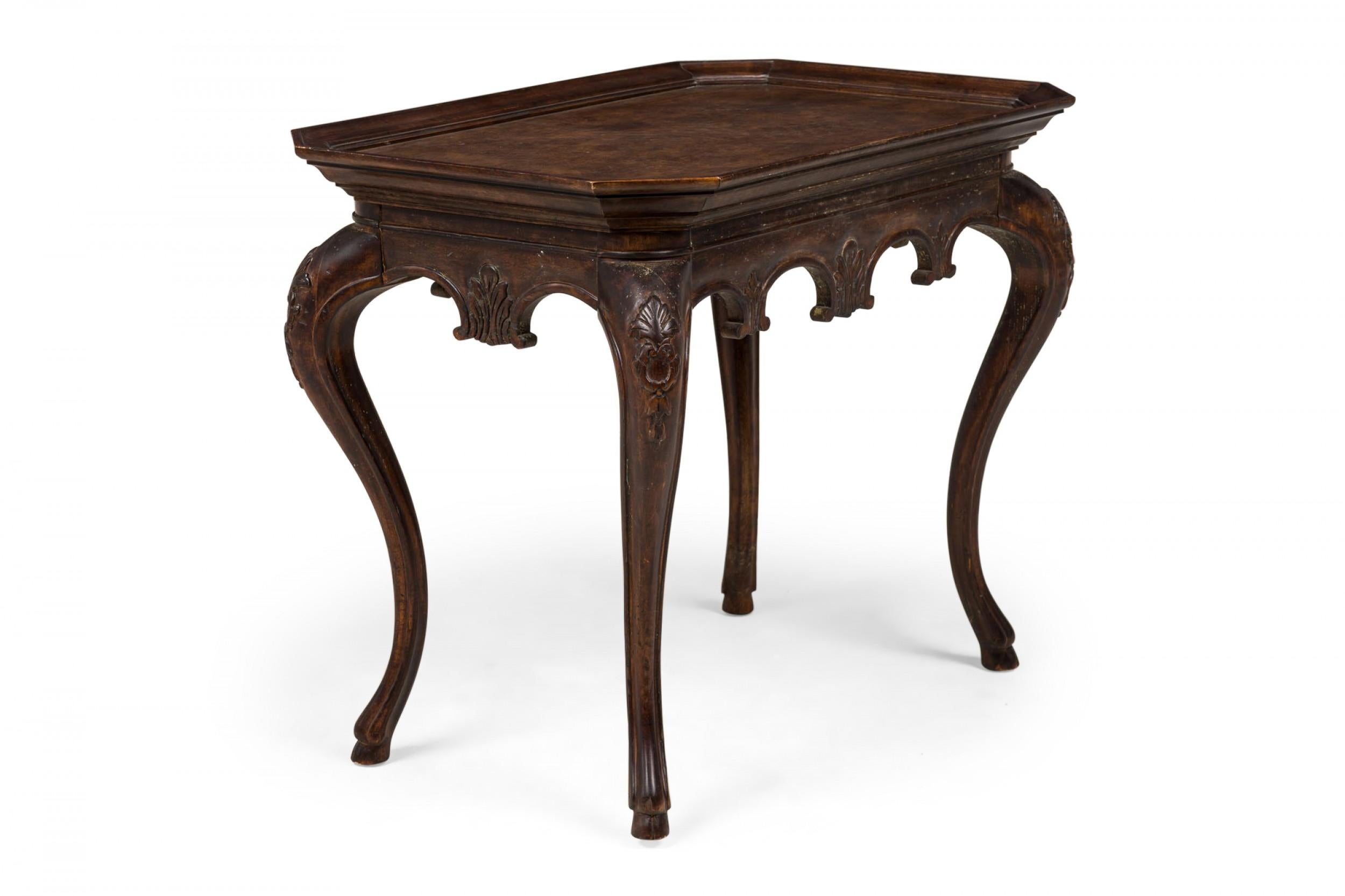 French Victorian-Style rectangular console / occasional table with an angled shallow beveled gallery around a marble veneer table top with canted corners, with carved apron and embellishments at the top curvature of the four cabriole legs.