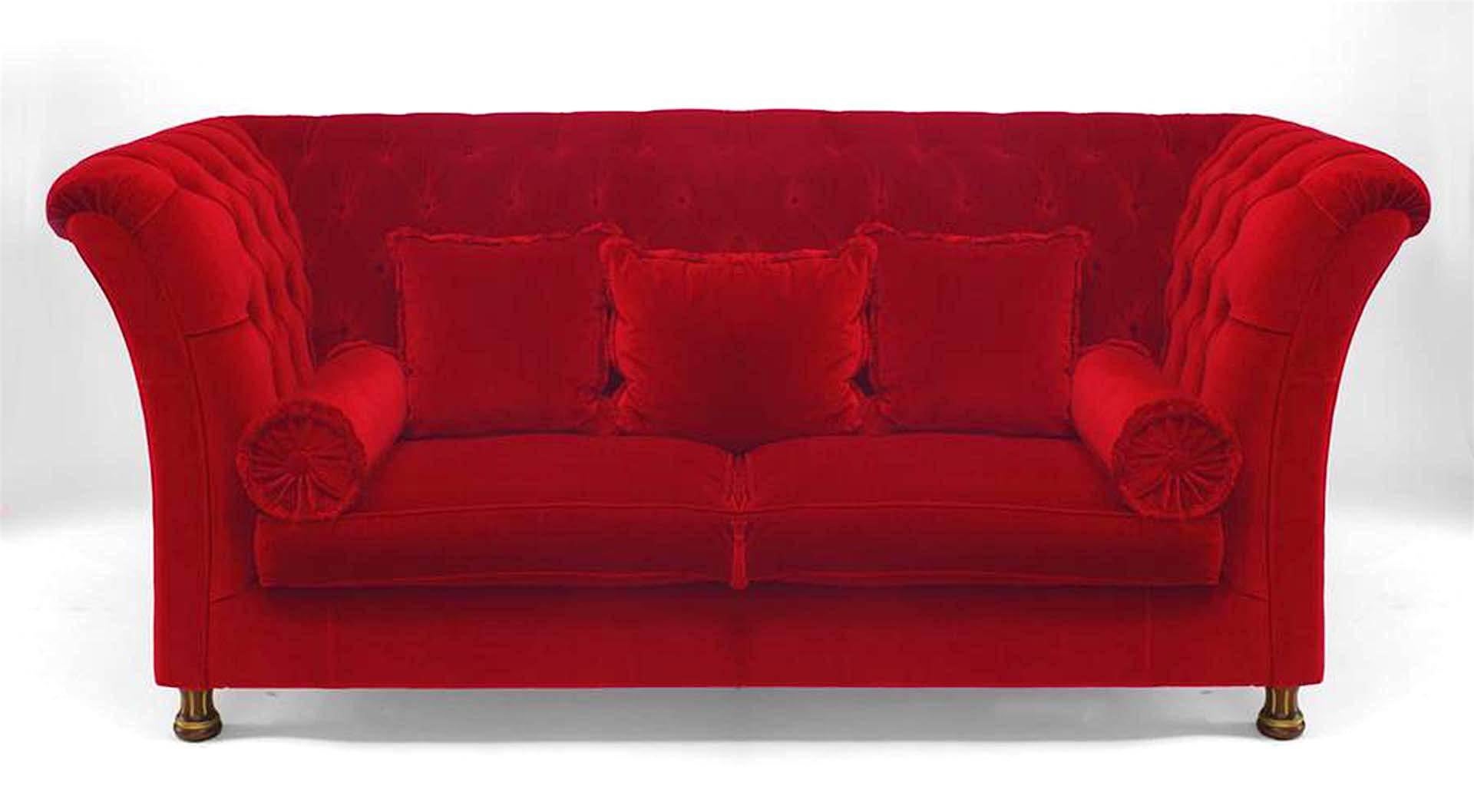 French Victorian style (modern) red tufted velvet settee with square back & side arms with 2 seat & bolster cushions and 3 loose back cushions standing on fluted gilt & walnut legs.
