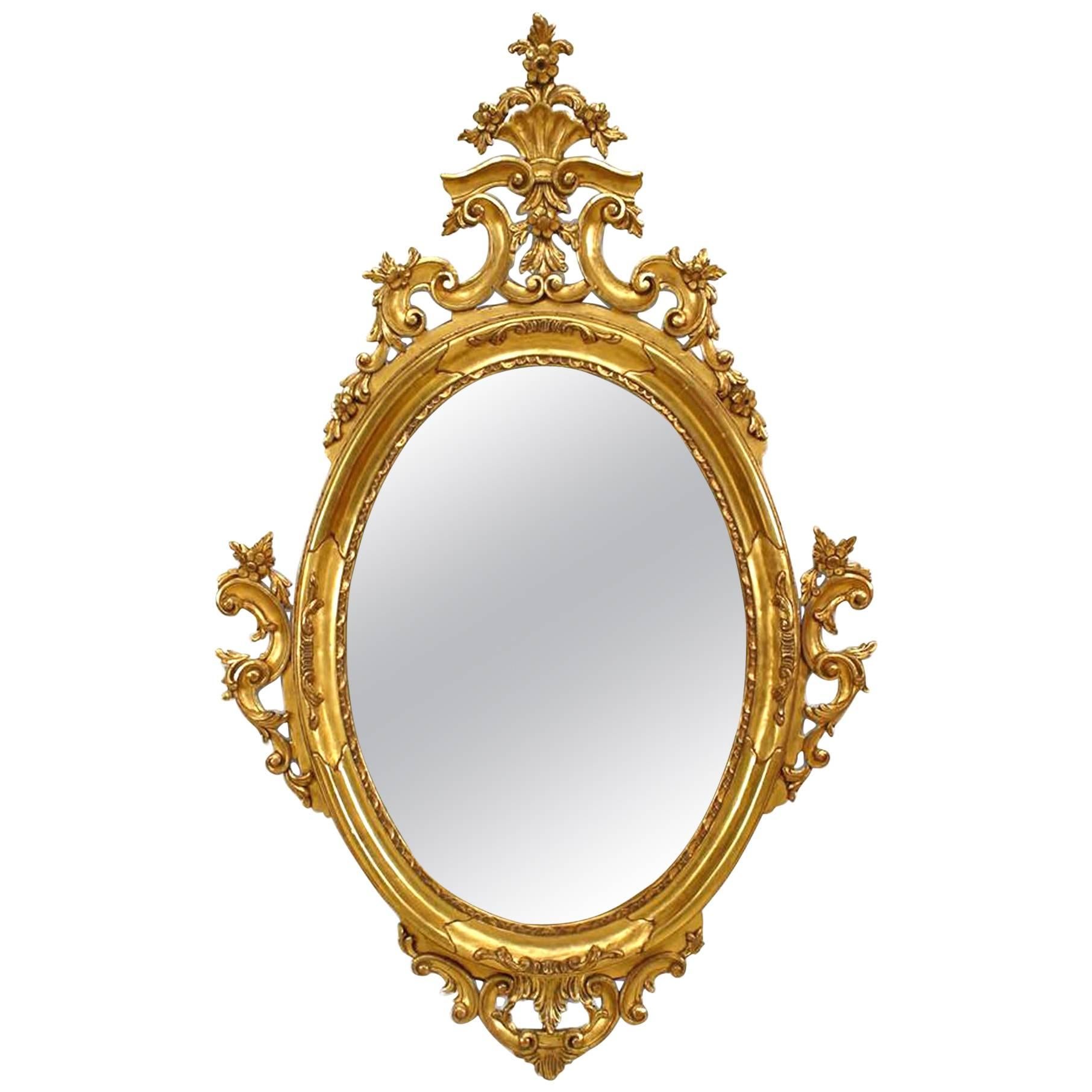 Miroir mural ovale de style victorien français en bois doré à volutes en filigrane