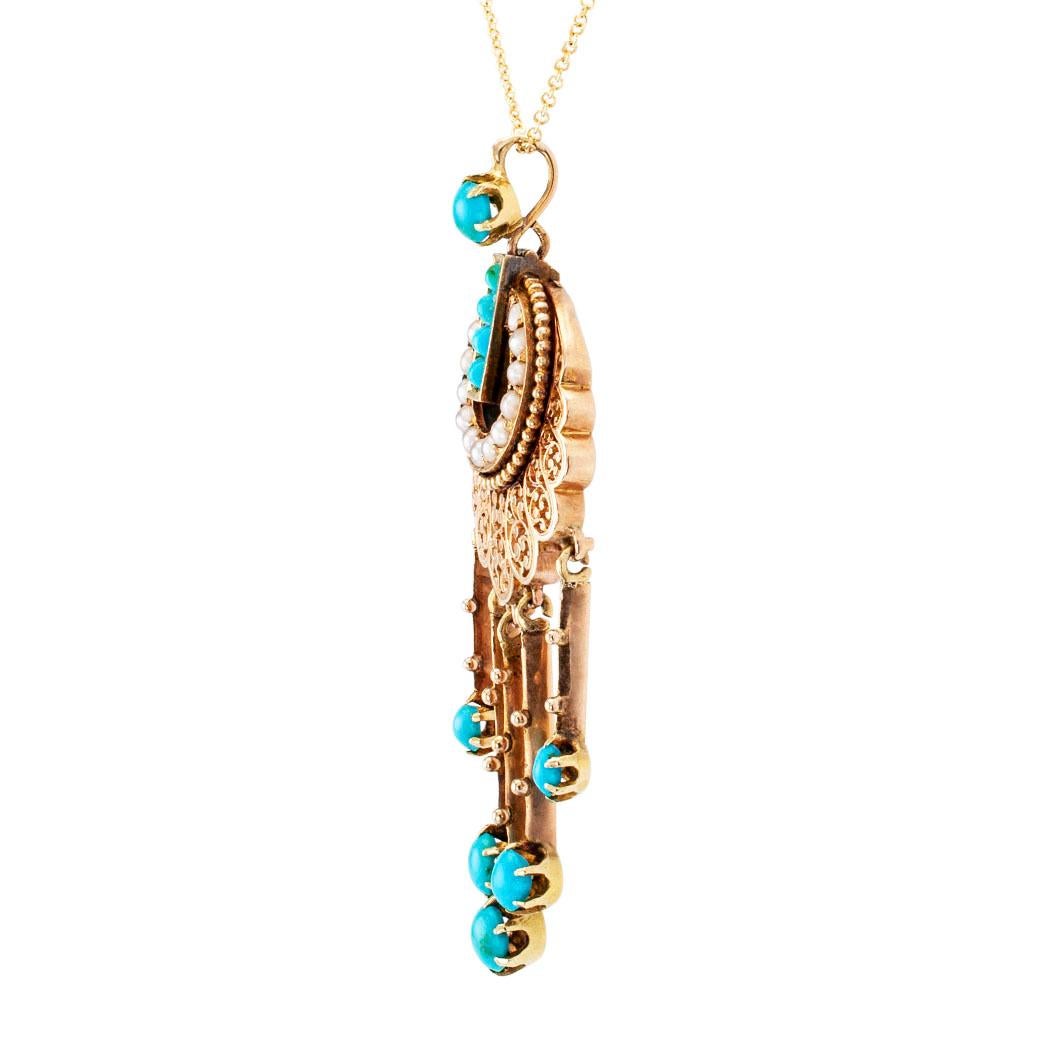 French Victorian turquoise pearl and gold pendant circa 1890. Designed as a pendant with a vertical course of four square-cut turquoise cabochons, breaking into an open circle of round pearls, edged by a circle of small gold beads to a graduating,
