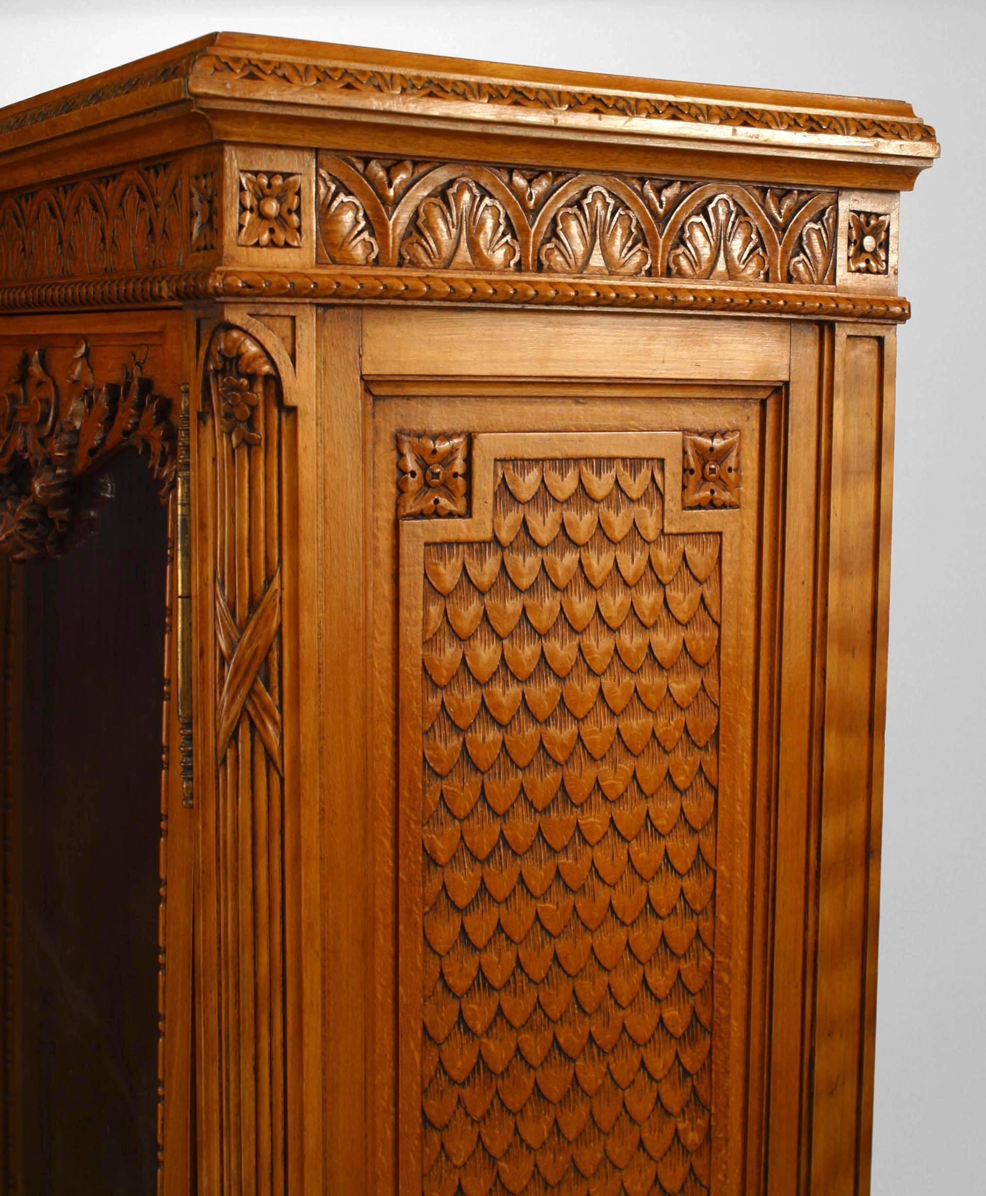 French Victorian walnut carved corner cabinet with 2 glass doors with applied urn carving on bottom and festoon top
