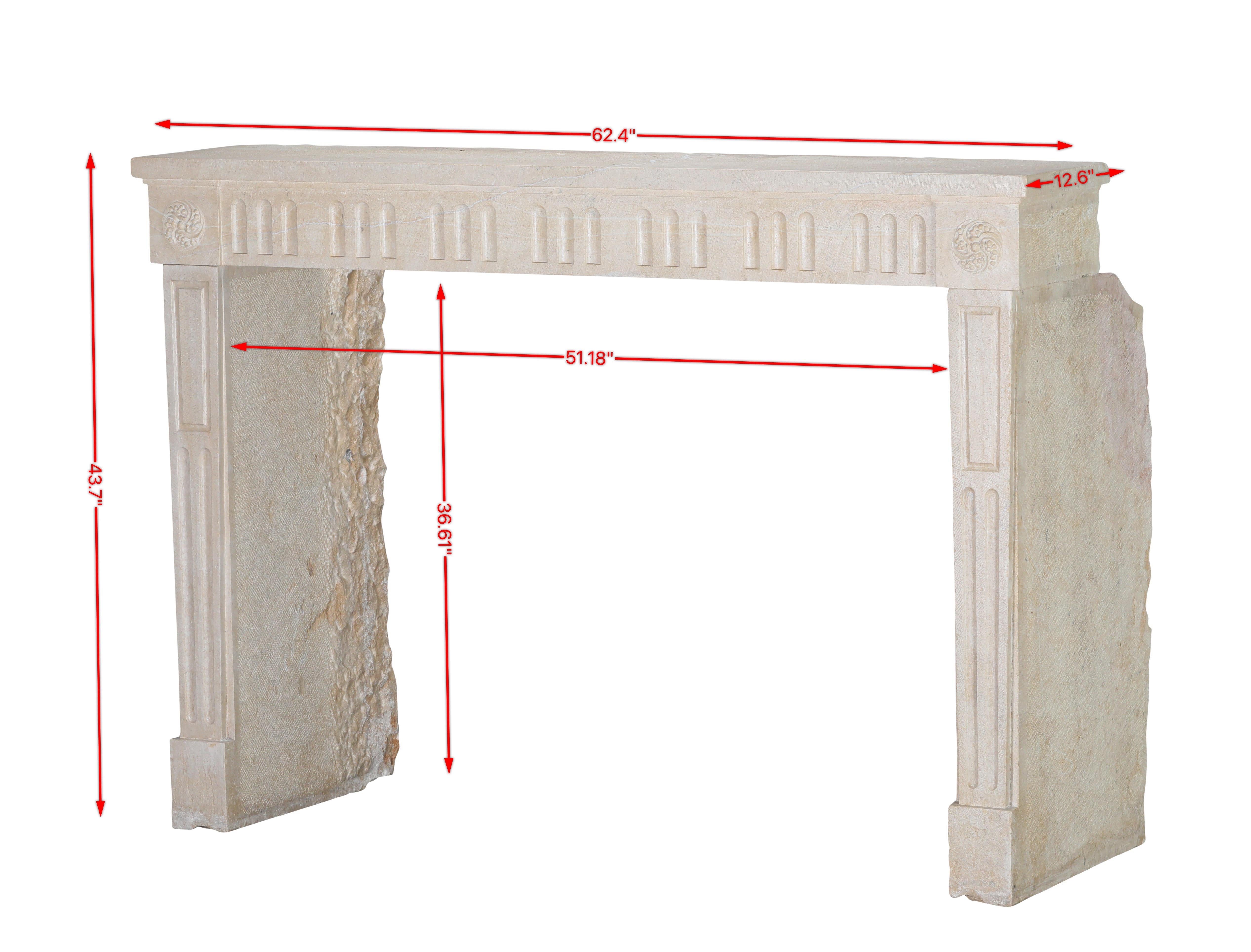 Louis XVI period limestone fireplace surround from France. Straight lines with a nice surface and feeling. French 18th century for timeless living with a French touch. Exceptional carving details of bunches of grapes on the main piece.
