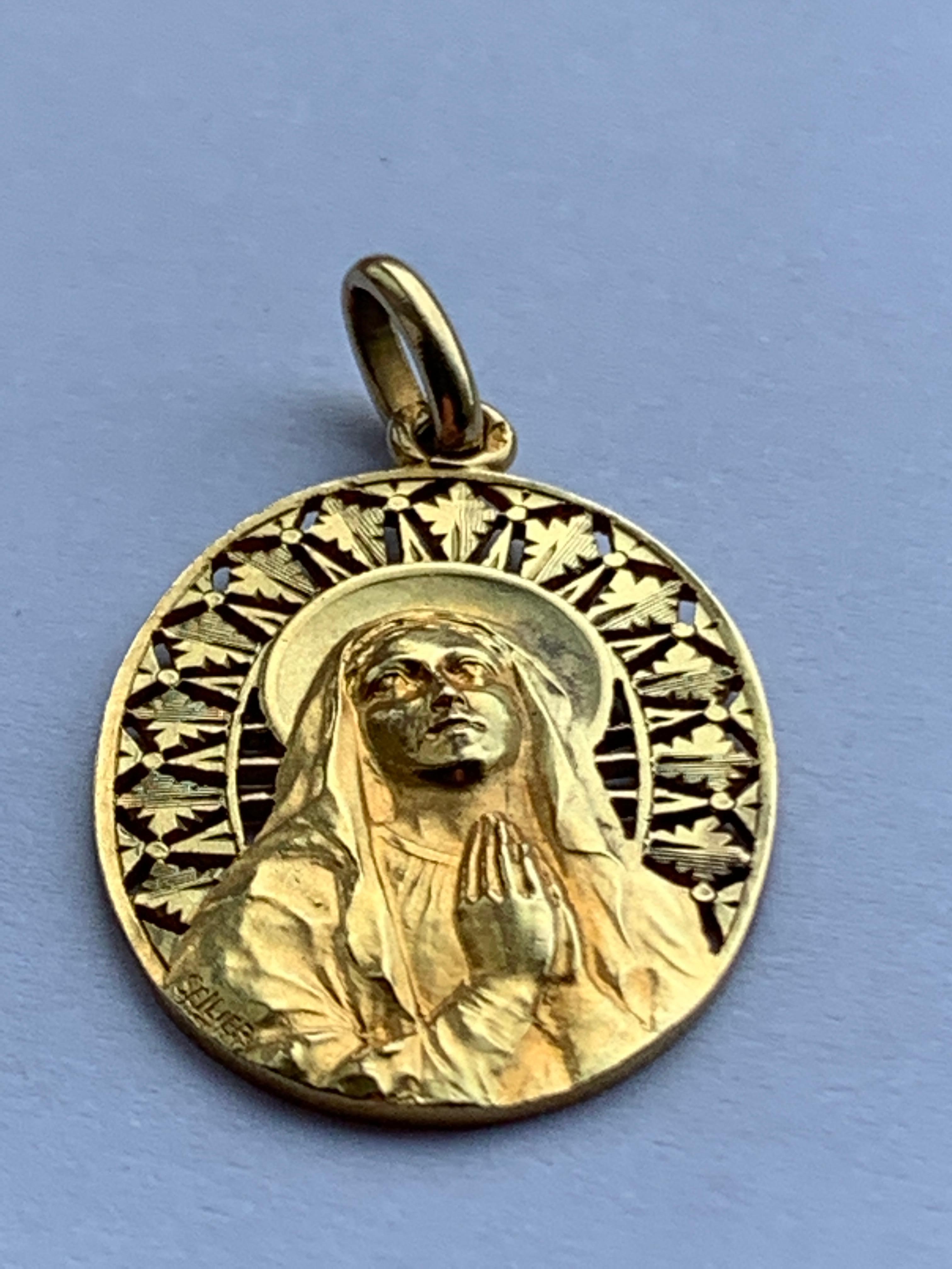 Beautiful 
18ct Gold French Virgin Mary Pendant 
Circa 1800's
In lovely condition 
Has an inscription on reverse dated 1958

Stamped clearly with French eagle 
and makers marks ( Diamond shape - can make out an A & B )
Unsure of Makers mark

Weight