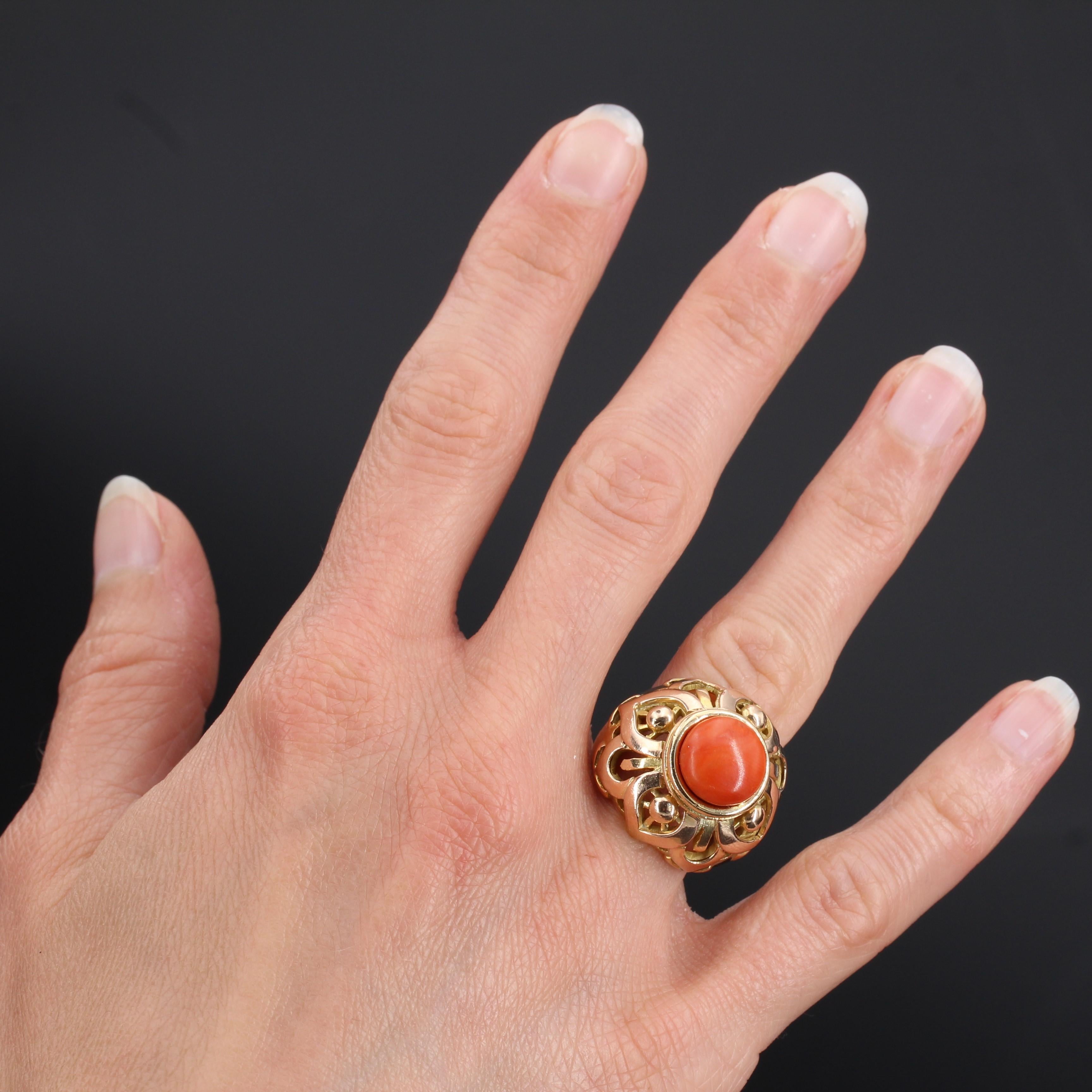 18 carat yellow gold ring, eagle head hallmark.
This splendid gold coral ring is made of a gold dome perforated and set on the top of a cabochon of natural Mediterranean coral.
Diameter of the coral: about 10.4 mm.
Height: 21 mm, width of the ring