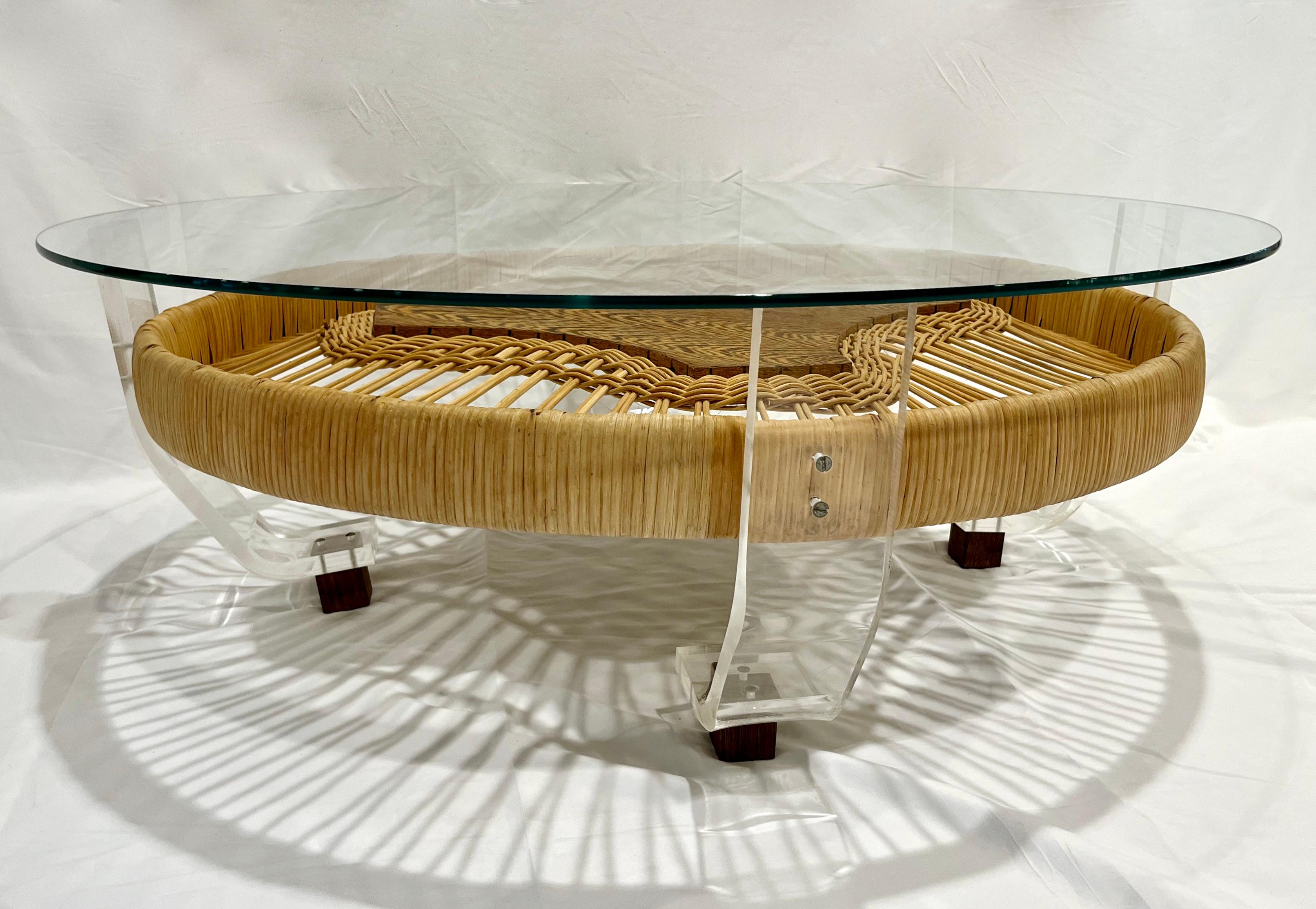 A unique french vintage work, a round sofa side coffee table entirely handcrafted in a very original way, using organic materials, the round bamboo shape consisting of a weaved rattan structure around a geometric center in patterned Brazilian wood,