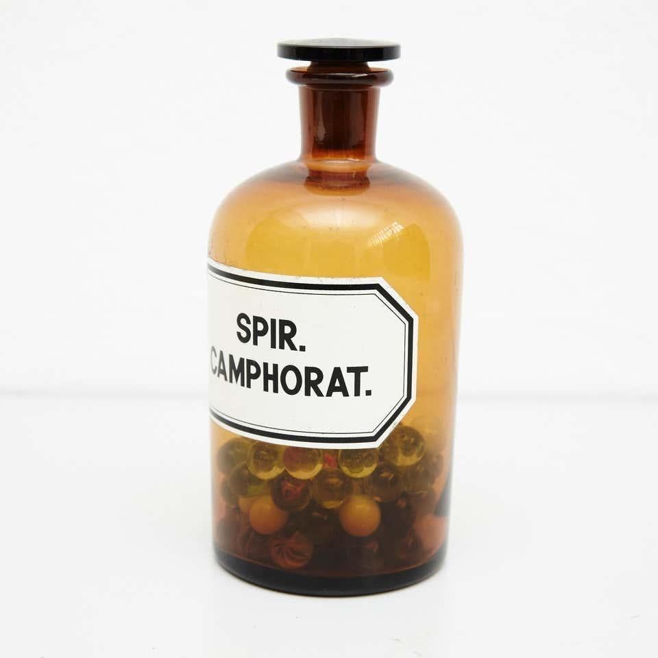 Mid-20th Century French Vintage Amber Glass Pharmacy Bottle with Marbles, circa 1930 For Sale